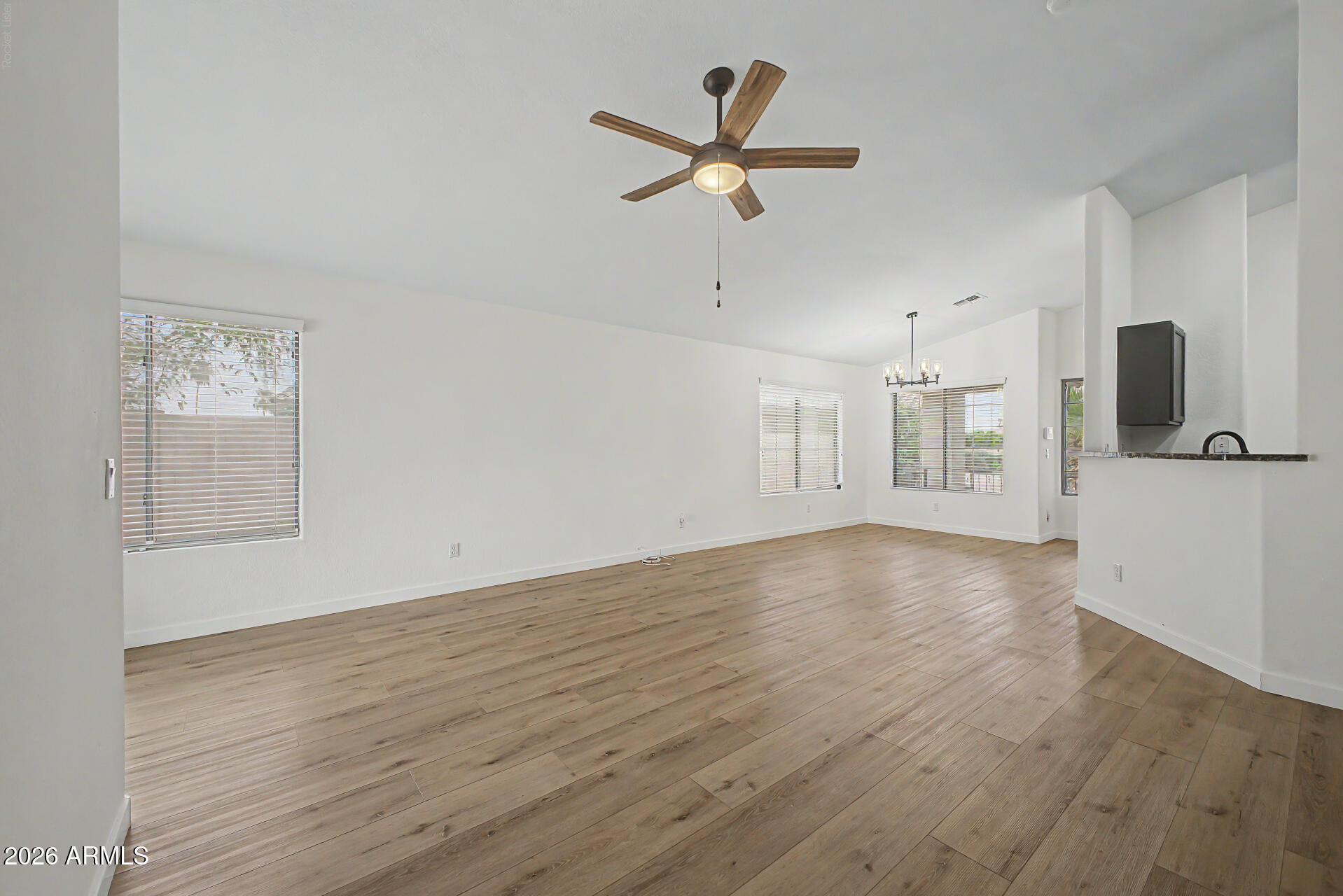 Fully Remodeled Home with modern finishes on an Oversized Cul-de-Sac Lot! This bright, open floor plan features vaulted ceilings, beautiful white oak wood-look flooring throughout, fresh paint, new interior doors, and stylish black finishes that give the home a clean, modern feel and on current trend. The kitchen and bathrooms have been tastefully updated with black cabinetry, creating a cohesive designer look throughout. Situated on a spacious 8,000 sq. ft. corner lot with no neighbor to the left, you'll enjoy added privacy. The RV gate provides easy access to the oversized backyard, offering plenty of space for a pool or your own outdoor entertaining.  Oversized two car garage with water softener.  All the major items including roof and A/C are newer.  Just waiting for the new owner.
