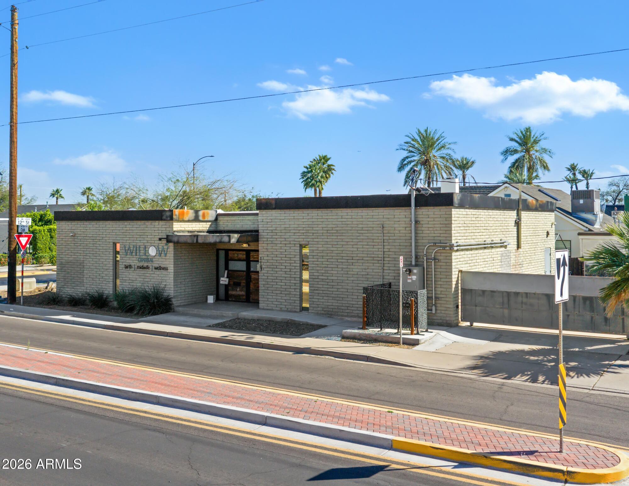 This freestanding retail/office building sits on a high-visibility corner lot at 12th Street and Oak Street in Central Phoenix. The 2,290 SF
building was renovated in 2021 and most recently operated as a birthing center. The layout includes three private suites each with
an in-suite bath, two exam rooms, two bathrooms, a large reception / waiting area, and a break room. Additionally, the property
includes fenced parking. The floor plan adapts readily to a wide range of professional, medical, or wellness uses.