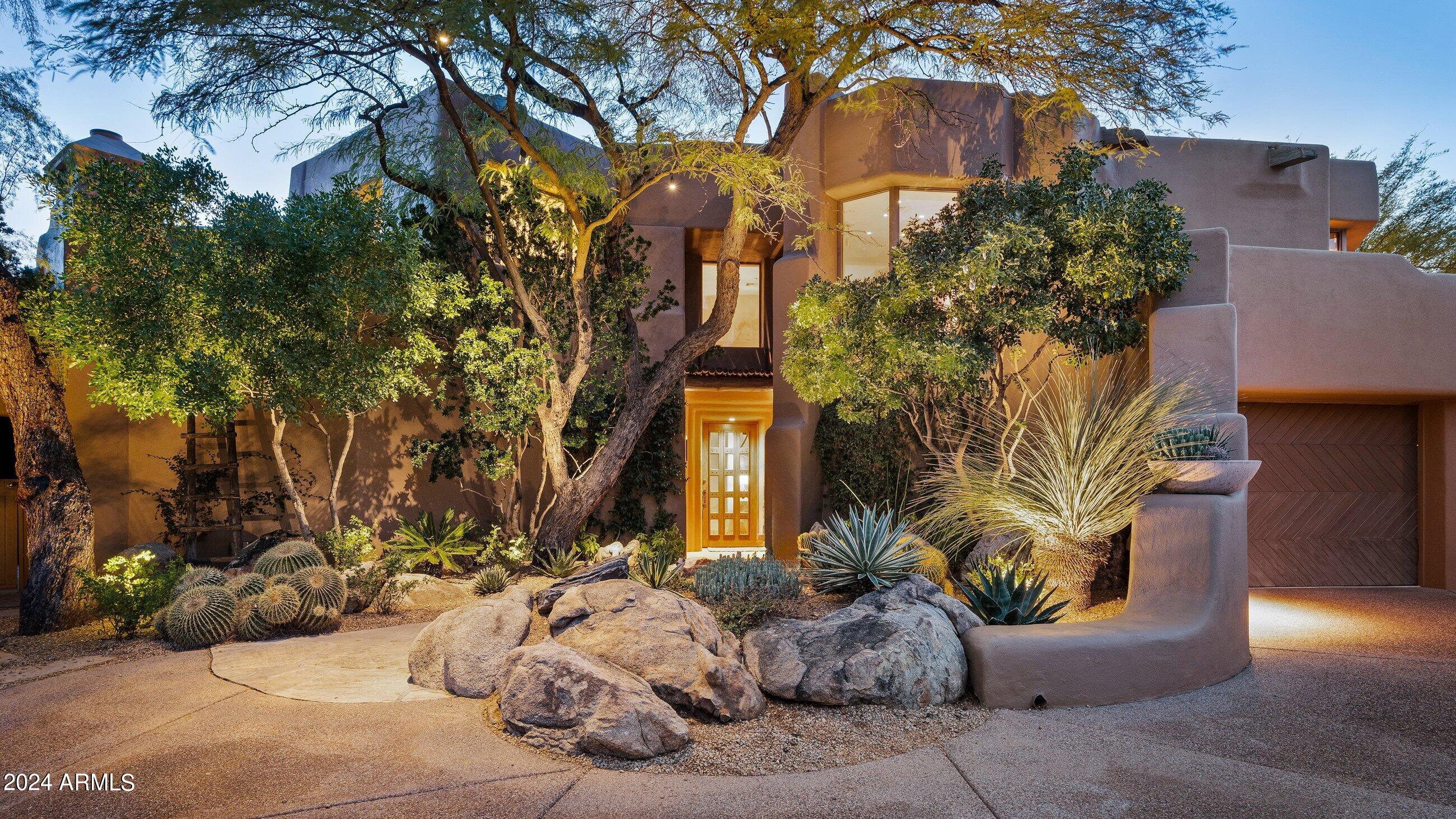GOLF MEMBERSHIP AVAILABLE WITH THIS PRIVATE 2.1+ ACRE PROPERTY IN DESERT MOUNTAIN.  The owner has legally affixed 2 1/2 lots to protect mountain, sunset and city light views to the south & west, as well as the Apache Peak mountain range and 5th fairway of Cochise to the north.  Professional, mature landscaping and abundant landscape lighting by world-renowned Jan Moyer make for a magical evening setting.  The 4,700+ sf home is a charming Lash McDaniel design whose Santa Fe style exudes the character a buyer seeking a classic Desert Mountain home desires.  The interior showcases classic southwest architectural touches with five fireplaces for those cool Arizona nights. A split Primary Suite and Junior Primary Suite are both on the main floor, while a 3rd bedroom with on-suite bath, as wel as a private dedicated office with fireplace are on the second floor.  Guests won't want to leave the beautifully appointed detached casita off the pool area with kitchenette and on-suite bath.  A bonus space accessible from a private outdoor atrium was originally designed as an artist studio but could also be used for fitness, workshop, a small business, media or simulator room.  Multiple outdoor entertaining areas feature a pool & hot tub, outdoor shower, fireplace lounge area, built-in grill & dining area, and multiple view decks. Prime mid-mountain location in Turquoise Ridge close to Sonoran Fitness and Recreation Complex.  In addition to six Nicklaus championship golf courses and a family-inspired par 30, you will enjoy a luxury desert lifestyle that includes 8 restaurants, fitness, spa, tennis, pickleball, bocce and a nationally-recognized hiking trail system.
