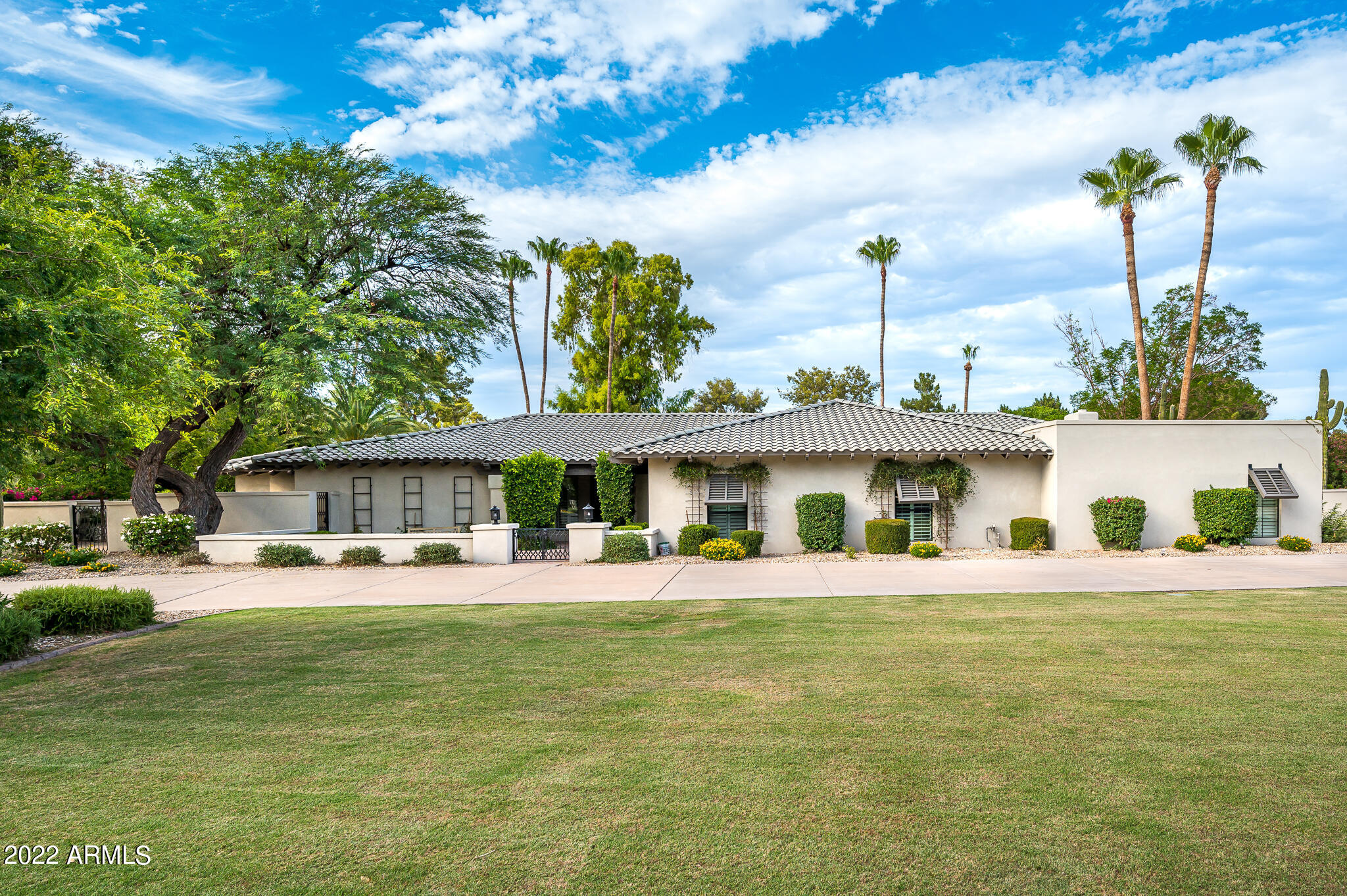 This stunning home is located in the heart of Paradise Valley on the 1st hole at Camelback Golf Club. Tastefully remodeled with interior for today's living. 5 bedroom 5 bath with detached guest casita. Gorgeous kitchen featured in Phoenix Home and Garden. New flooring throughout, large windows and glass doors framing the lush landscape and golf course views. Charming patios for entertaining and to enjoy the lush outdoor living. Raised ceilings, new windows, custom cabinetry throughout. Highly desirable 3 - C schools! A must see!
