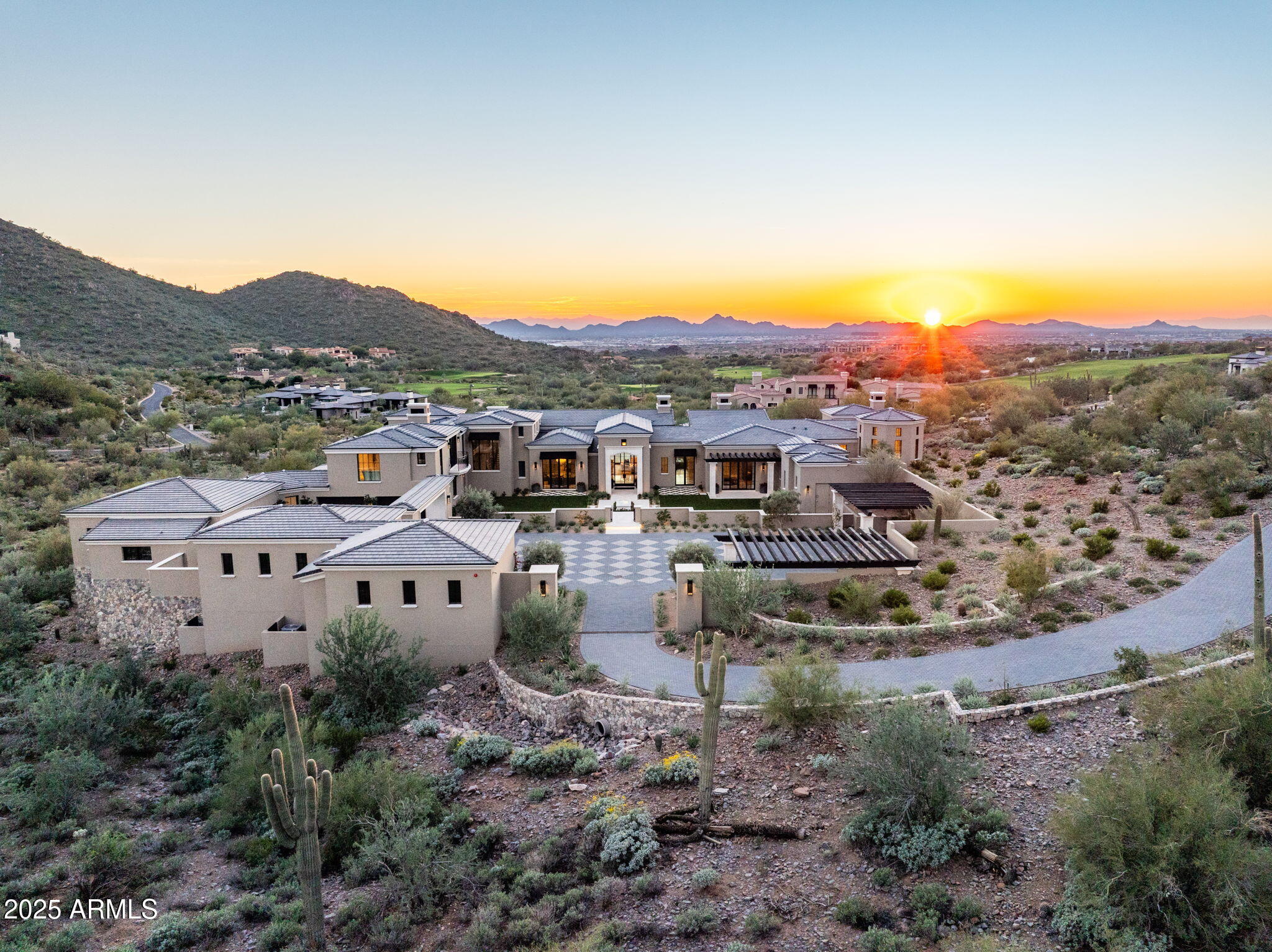 Secluded in Silverleaf's exclusive Horseshoe Canyon, this 12,128 SF modern Mediterranean estate is newly constructed by Salcito Custom Homes and Salcito Design Group, with French-style gardens designed by Berghoff Design Group. Spanning 3.67 acres of elevated desert landscape, the luxurious estate offers privacy and breathtaking views. Private estate gate opens to an expansive harlequin-patterned motor court with twelve-foot glass and steel entry doors framing views of the McDowell Mountains, Silverleaf golf course and city lights. Light-filled interior features Calacatta Carrara marble and French oak hardwood flooring with 17' ceilings. Floorplan features five bedroom suites, five full baths, two powder rooms, dedicated pool bath, a private office and versatile flex spaces. Ultimate chef's kitchen with hidden bar, motorized pass-through window bar and a fully equipped back kitchen. Separate eight-sided family lounge overlooks the Silverleaf golf course. Owner's retreat features private foyer, marble fireplace, sitting area, spa bath, private gym, morning bar, dual wardrobes with laundry and boutique-inspired shoe and purse pavilion with 16' ceilings. 

Seamless indoor-outdoor living with automated glass doors in the great room opening to resort-style infinity-edge pool with spa, outdoor kitchen, an enclosed ramada with fireplace and powder bath. Completing the main level is the formal dining room paired with a wine room, two guest suites, laundry room and elevator. The upper level features a sophisticated sunset lounge with bar/kitchen amenities, picturesque views and a luxurious, second primary suite. Lower level offers a large guest suite, a study/flex room and direct access to an extended rare flat yard - perfect play area for children or pets. Air-conditioned room off the garage is perfect for dog grooming, an artist's studio, or a greenhouse. Cutting-edge technology and smart home systems elevate the estate to meet modern demands. Discreetly positioned garages can accommodate 8 to 16 vehicles. 
This estate is one of 24 exclusive custom homesites in Silverleaf. Surrounded by the McDowell Sonoran Preserve, Silverleaf combines natural desert beauty with world-class amenities, making it the pinnacle of luxury living.
