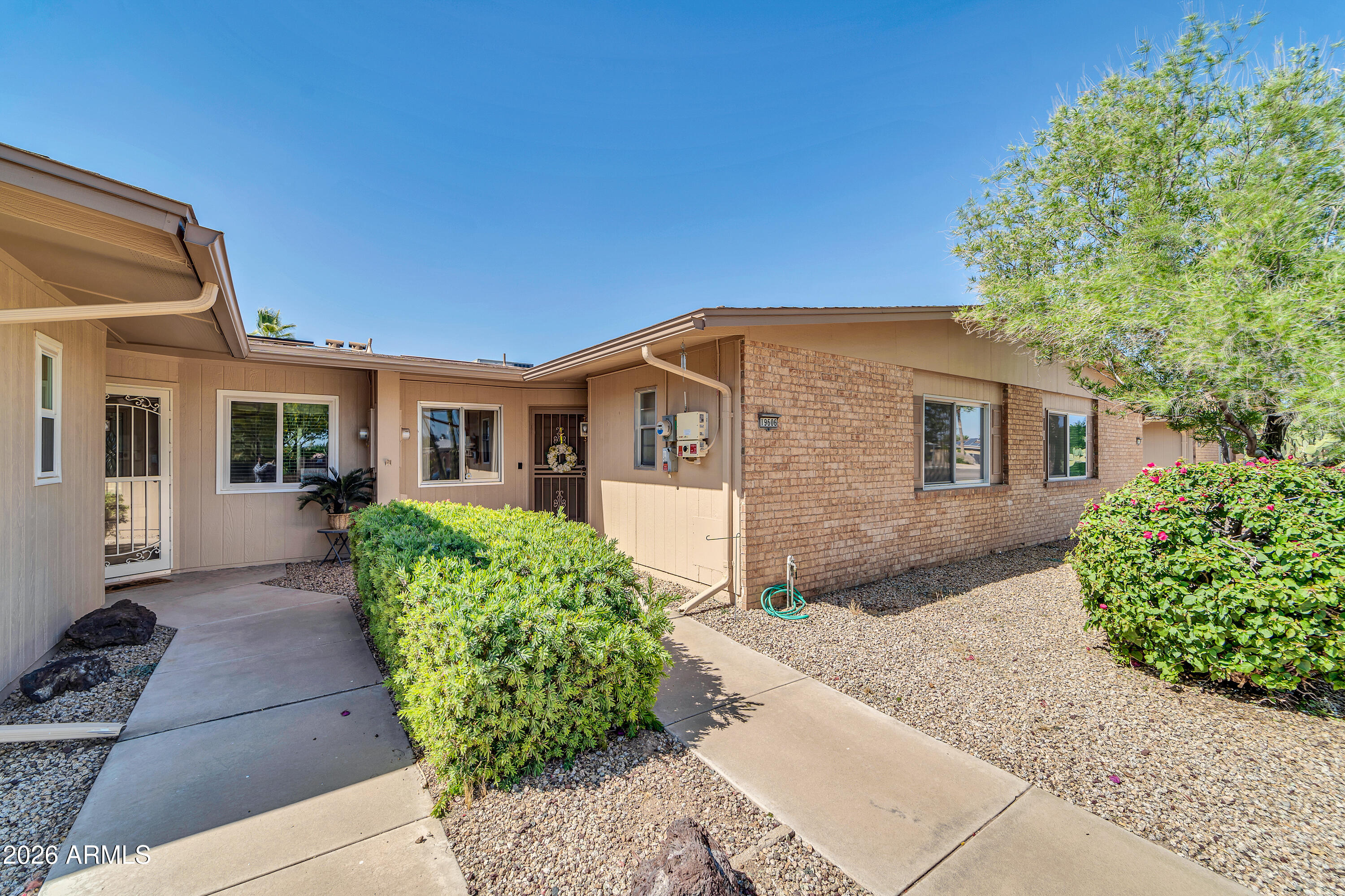 The home features a great room that combines a dining and living area, with a skylight that fills the home with natural light. Adjacent is a bonus room with updated wood-grain laminate flooring, leading to a private courtyard with a North-facing exposure perfect as an office, den, or spare bedroom! The kitchen has an eat-in nook, a smooth top electric range, and a pantry. The master bedroom has a sizable walk-in closet. The bathroom has a beautifully tiled walk-in shower. The extra deep single-car garage is accessed through the indoor laundry room with storage. The home has a new roof installed in 2022 and fresh paint from 2021 - both covered by the association, a new water heater in 2021 and A/C in 2009. To top it off, the home has a low solar lease for added savings on your utilities.