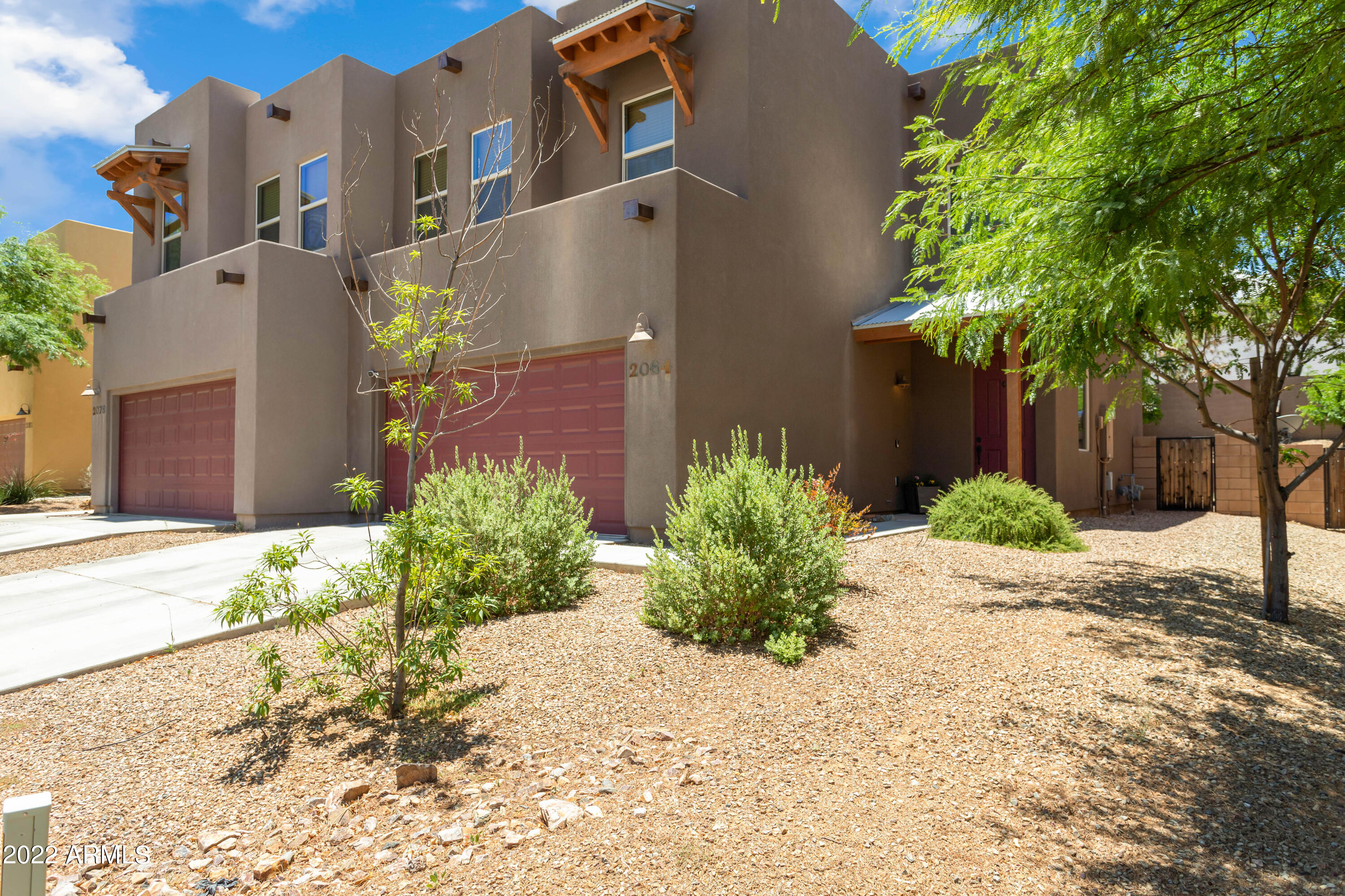 End Unit! Large 2 Story Townhouse in Cimmarron Estates. Central location only a few blocks from Veterans park, easy access to Hwy 90 Bypass and Ft Huachuca.  Wood Blinds. Appliances stay. Full size 2 car garage. Great kitchen with breakfast bar. 42'' maple cabinets. 18'' ceramic tile in wet areas. Executive height bath vanities. Spacious master suite with walk-in closet. Half bath on 1st floor. A/C & Gas heat. Energy Star Qualified. Low Flow Water Faucets. Santa Fe Style with Stucco Exterior. All bedrooms & laundry on 2nd floor.