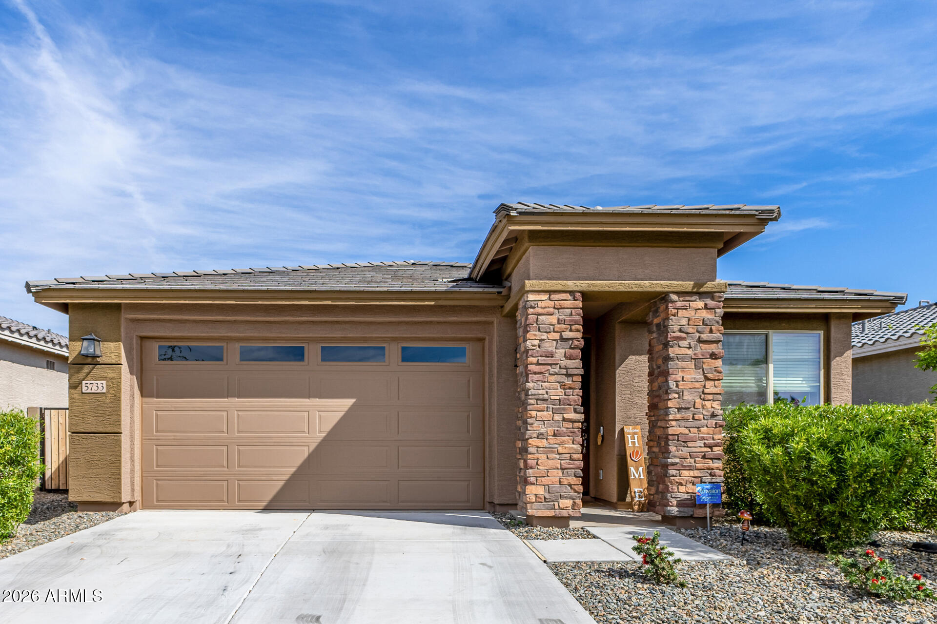 Welcome to your new home in a desirable Litchfield Park neighborhood! This beautifully maintained 3-bedroom, 2-bath home is just a couple years old and offers modern finishes throughout. Enjoy great curb appeal with an inviting, professionally landscaped front yard, all conveniently located directly across from a community park. The upgraded kitchen features quartz countertops and a large island as well as stainless steel Whirlpool appliances, including a convection oven and refrigerator. A Samsung washer and dryer are also included for added convenience. Home has lots of tile throughout except in the two spare bedrooms. Additional highlights include soft water plumbing and Smart Home wiring, providing both comfort and modern functionality.