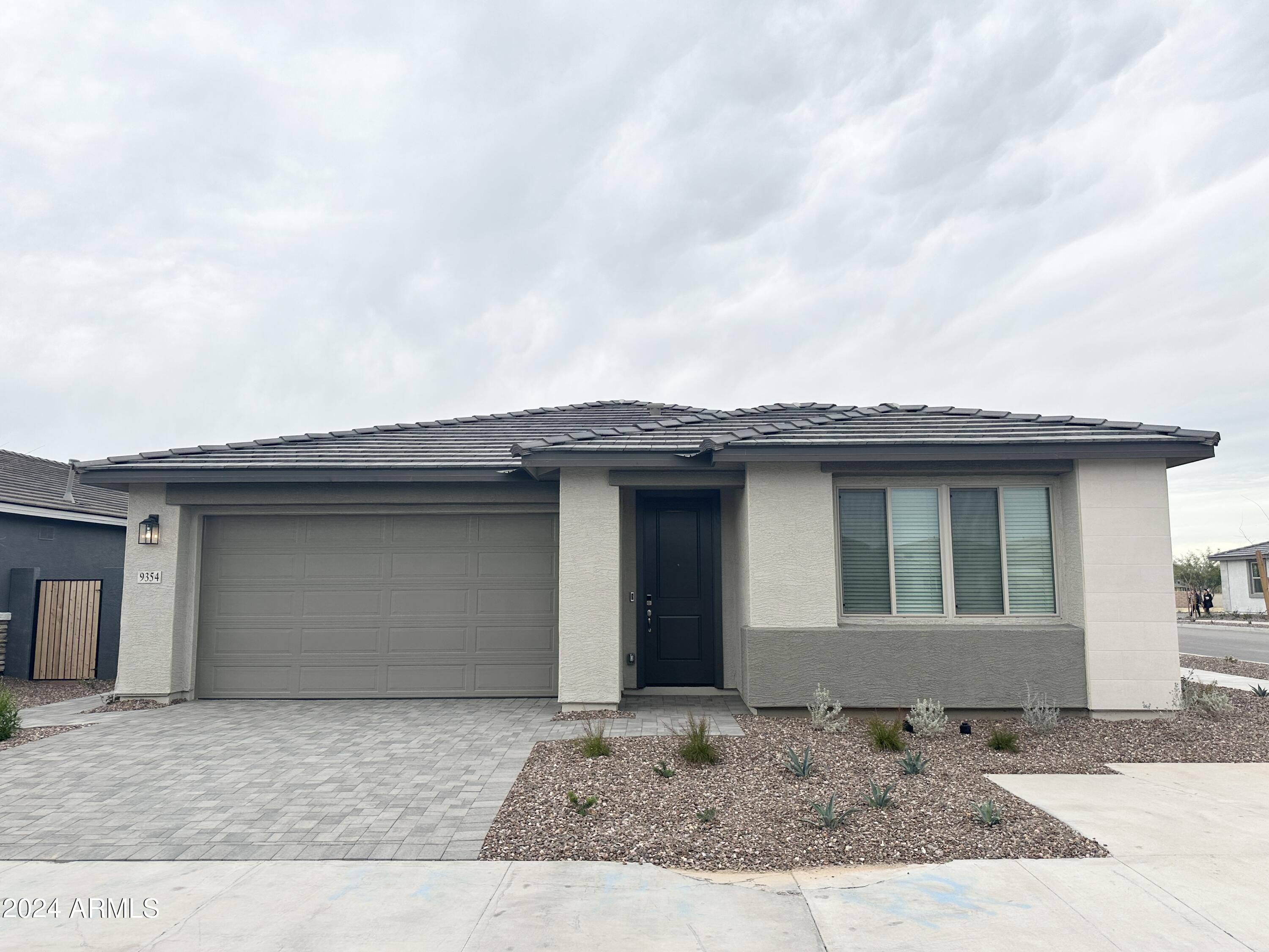 Welcome to this stunning 3 bed, 2 bath corner-lot home offering modern style and energy-efficient living! Enjoy a bright open layout with a large 4-panel slider that seamlessly connects indoor and outdoor spaces. The kitchen features granite countertops and plenty of storage, wood-look tile in main areas and carpet in the bedrooms, and the epoxy-coated garage floors add a clean, upscale touch. Built for remarkable comfort, sustainability, and energy savings. This home delivers style, efficiency, and low-maintenance living.