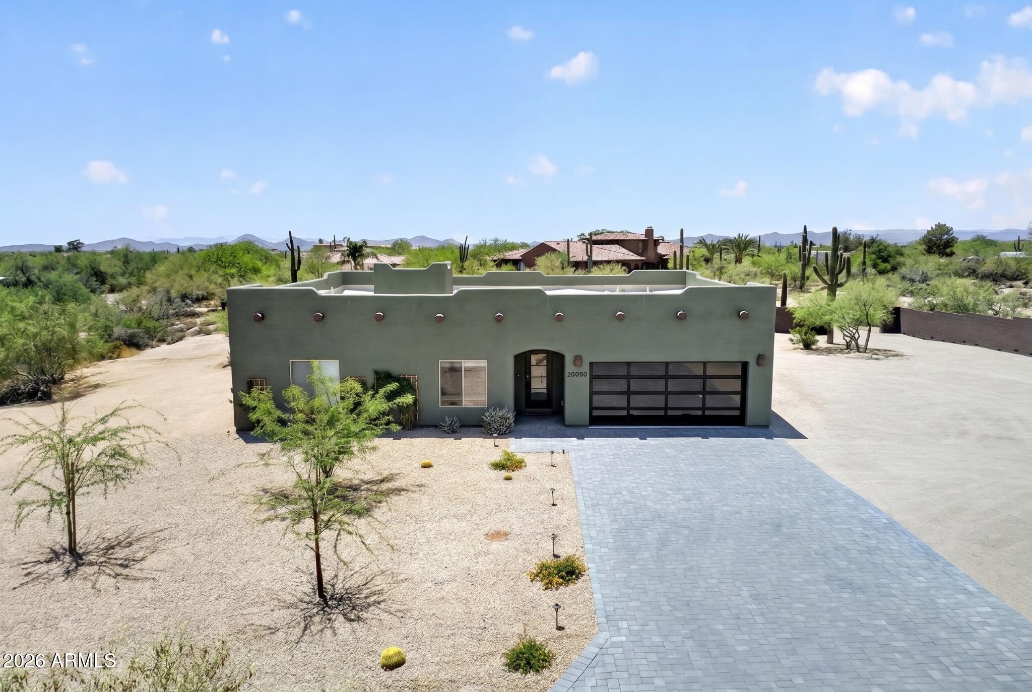 BUILT IN 2025. Great Location, over an ACRE Lot surrounded by beautiful SAGUAROs and Desert Views!  Contemporary split-floor plan featuring LUXURY FINISHES, Hard Wood and Porcelain Tile Floors. Chef's Kitchen, White Soft-close cabinets, Pull-out Drawers, Under-Cabinet Lighting, black finishes, WATERFALL Granite Island w/Large Cooktop and POT FILLER! 3 Sliding Doors lead to Extended Covered Paver Patio. Enjoy SUNSETS and STAR GAZING!  Great Room features Built-in FIREPLACE and TV Niche. Luxury Guest Bath, 2 Guest Bedrooms w/Built-in Closet Systems. Retire in Spacious Primary Bedroom w/ FIREPLACE, Sliding Door to Back Patio, Luxury Bath w/Large Jetted Tub, Walk-in Shower, Dual Sinks and Custom Designed Walk-in Closet.  Be Sure to Check-out Dream Laundry Room, it's Amazing! There's More! Newer Construction Built in 2025
Energy Efficient Construction, Move-in Ready
Over an Acre Lot 51,225 sq ft (Flat Lot)
No HOA
County Island, Lower Property Taxes
Zoned for Horses
Surrounded by Acre Plus Lots 
Paved Road Leading to Home off Lone Mountain

EXTERIOR
Roof 2025
AC 2025
Water Heater 2025
Energy Efficient Dual Pane Windows
Private Well (2025)
Septic 1000 gallon
Exterior Smooth Texture Stucco
Block Fence on North and West Sides of Property
4 Panel Glass Contemporary Front Door with Smart Palm Print Lock System
Paver Driveway and Walkway to Front of Home
Rain Gutters, Take Water Underground Away from Home towards Natural Wash
Garage Door - 16 Window Contemporary Design
Garage Overhead Storage Racks
Garage Door Opener Lift Master (download MyQ app and if you pay, you can have video in garage)
Front Yard - Desert Designed Landscaping with Auto Watering System
Front Yard - Night Lighting on Trees, House & Driveway
Backyard - Extended Covered Paver Patio with Recessed Lighting
Southside Yard - Beautiful Natural Desert Landscape
Southside Yard - Natural Wash
Natural Desert Landscape with Large Saguaro Cactus
Beautiful Sunsets off Back Patio!  
Endless Opportunities for Star Gazing

INTERIOR
Single Level, No Interior Steps
Split Floor plan - Primary Bedroom is separate from two Guest Bedrooms
Bright n' Airy, 9' Ceilings, Plenty of Natural Lighting
Fossil Hickory Solid Hard Wood Flooring and Porcelain Tile - NO Carpet!
6" Baseboards
Two-tone Paint
Recessed Lighting
Cheyenne Smooth 2-Panel Interior Doors with Black Door Knobs
42" Baysquirrel Crystal Fandelier Bluetooth Ceiling Fan/Light w/ Retractable Invisible Blades, Changing Colors, Surround Sound, Smart Remote/App Control 
2" Window Blind Coverings
Whole House Water Purification System w/ Water Softener and Express Water Reverse Osmosis
2 Large Sliding Doors off Kitchen Provide Beautiful Backyard and Desert Landscape Views

GREAT ROOM
Spacious Room off Kitchen, 
Custom TV Niche with Up-lights
Large Electric Changing Color Fireplace
Overlooks Backyard Views
Large Sliding Glass Door Leads to Expanded Covered Patio

KITCHEN
You'll love the Chef's Kitchen!
White Shaker Cabinets with Crown Molding and Black Knobs/Drawer Pulls, Pull-out Shelves, Under-Cabinet Lighting,
Black Plumbing Features
Recessed Lighting
Center Island features Waterfall White Granite, Luxury Forno Cooktop, Deck Mounted Retractable Pot Water Filler and Ducted Island Vent Hood
Under-cabinet Lighting
Dream Walk-in Pantry with Custom Shelving System and Pull-out Shelving
Forno Built-in Refrigerator with Two Freezer Sections
Forno Microwave/Convection Oven & Dishwasher

LAUNDRY ROOM
Many Upper and Lower Cabinets, Under Cabinet Lighting, Black Knobs/Pulls and Granite Countertops
Wash Sink, Folding Counter and Skylight for Natural Lighting 
Additional Storage Behind Entry Door

GUEST ROOMS AND BATH
Both Guest Bedrooms Feature Mirrored Closet Doors, Crystal Ceiling Fan, Built-in Closet System
NOTE:  Closet 2 - Be sure to check out the additional space within closets on left and right side!
Desert Views
Guest Bath features Double Sinks, Decorative Tile, Shower/Tub with Black Framed Glass Door, Custom Tile Work, Decorative Light Fixtures, Elongated Comfort Height Toilet

PRIMARY BEDROOM AND BATH
Wow!  You'll Love the Space!  Large Sliding Glass Door Overlooks Backyard, Electric Fireplace, Crystal Ceiling Fan
The Bathroom is Amazing!  Double Sinks, Black Plumbing and Light Fixtures, Large Walk-in Shower with Rain Shower and Regular Shower Head, Adjustable Mini Body Sprays, Large Jetted Soaker Tub with Waterfall Tub Spout and Handheld Spray Head
Walk-in Closet is Spacious and has a Custom Built-in Clothes and Drawer System

PRIVATE YET CONVENIENT
Just off Lone Mountain and Sunrise Ranch Road NOTE:  Low Traffic as this is NOT a Thru Street
Surrounded by Large Luxury Homes - Such a Pretty Drive into the Neighborhood
Close to Grocery:  AJ's Fine Food 2.9 miles, Sprouts 3.3 miles, Safeway 3.5 miles, Fry's 3.5 miles
Target 3.5 miles
Starbucks, Restaurants, Nail Salons, Pilates, etc 2.8 miles
GOLF Tatum Ranch Golf Club - 3.8 miles
Abrazo Cave Creek Hospital - 12 miles
Cave Creek Fun, Bars, Restaurants, Shopping - 6.3 miles
Bartlett Lake 26 miles, Lake Pleasant 36 miles
Desert Ridge Mall - 8.4 miles
COMING SOON:  Lone Mountain Park off 56th Street and Montgomery. Website states the new park will include: pickleball, tennis, basketball and sand volleyball courts. Including a baseball field, multi-use sports field, walking trails, playground area, skate plaza, three tier dog park, splash pad, shade structures, and restroom buildings. The project will begin Spring 2026 and is estimated to be complete in Fall 2027.