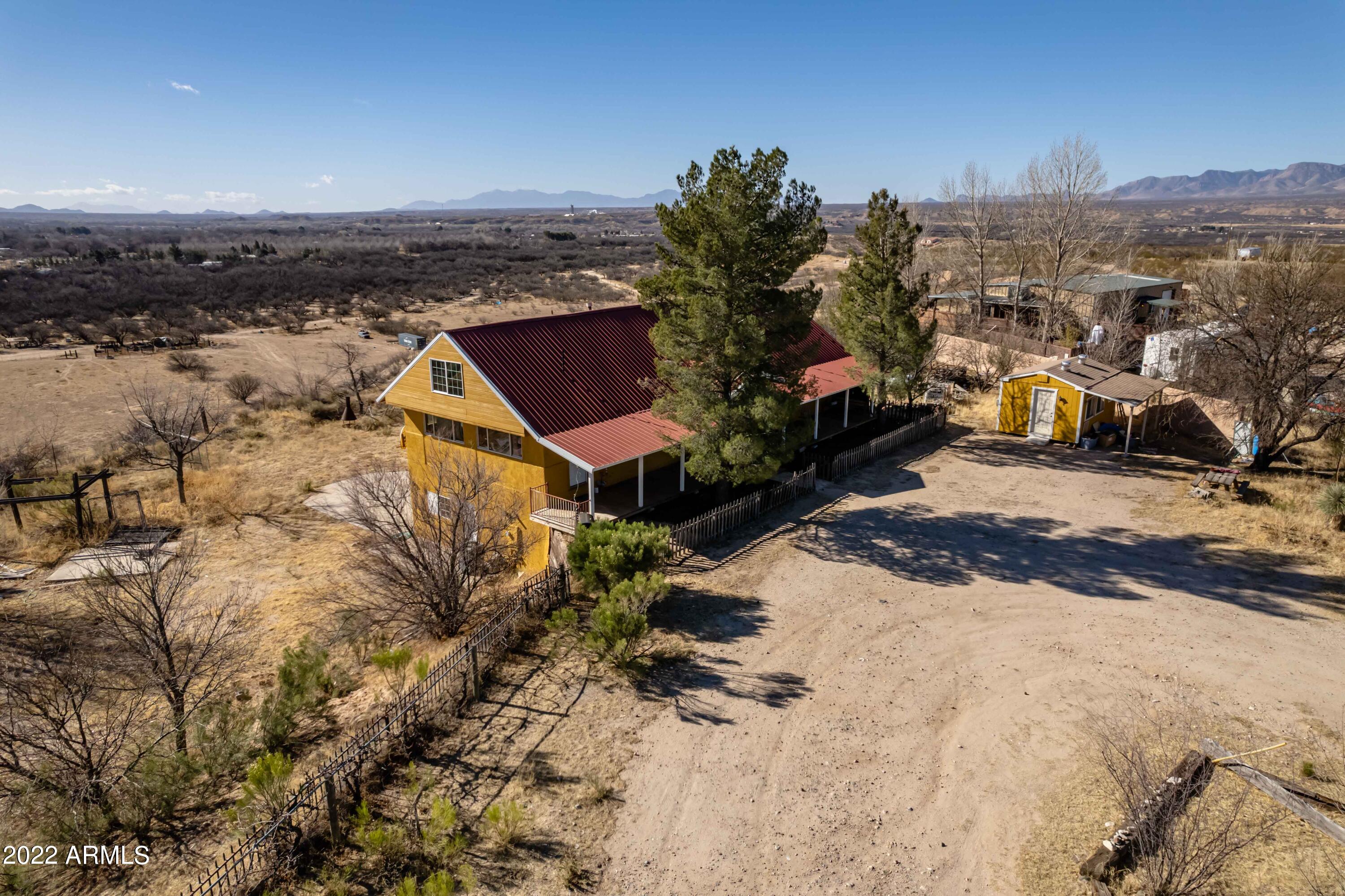 You've found a place to hang your HEART!  Overlooking the beautiful St. David, this multi-level home sits on 5.12 acres with panoramic views and welcomes the entire family the moment you step foot in the door.  Come sit on the covered front porch and enjoy the quiet serenity of nature.  Uniquely designed, the entrance is located on the top level which features the main living area with fireplace, spacious kitchen, primary suite and jetted tub, enclosed office area and loft!  The basement or lower level includes 3 additional bedrooms with an optional exercise room/office, laundry room with huge storage area and the entertainment/theater room!  Exit the lower level to access the backyard.  Plenty of space to build a shop, park your RV or have horses and the views!  Don't wait!  Call TODAY!
