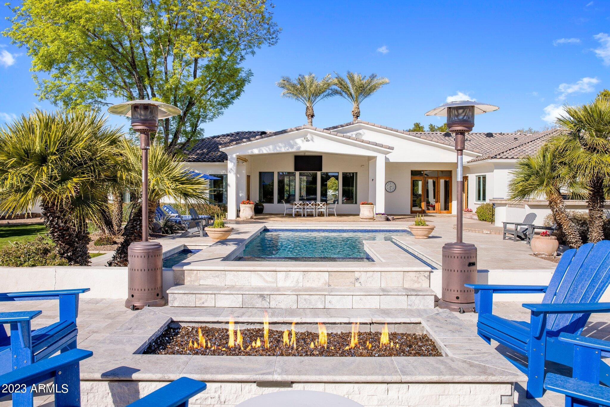 Welcome to a Meticulously maintained Santa Barbara style estate, set on over 1 acre in a private and peaceful cul-de-sac in the sought-after Town of Paradise Valley. As you enter the home, your immediate view of the resort-like backyard with heated pool, spa, and mountain views defines the relaxing atmosphere of this beautiful estate. Immaculately kept, this home is either ready to move in, or to model to your vision. The spacious open plan living room, includes kitchen with Viking gas stove, Sub Zero refrigerator, ample storage and two walk in pantries. A separate media room, with views to Camelback Mountain contains multiple TV's, Dolby Atmos speakers and Control 4 home automation. The split floor plan offers a large master suite and den, as well as four additional en-suite bedrooms.