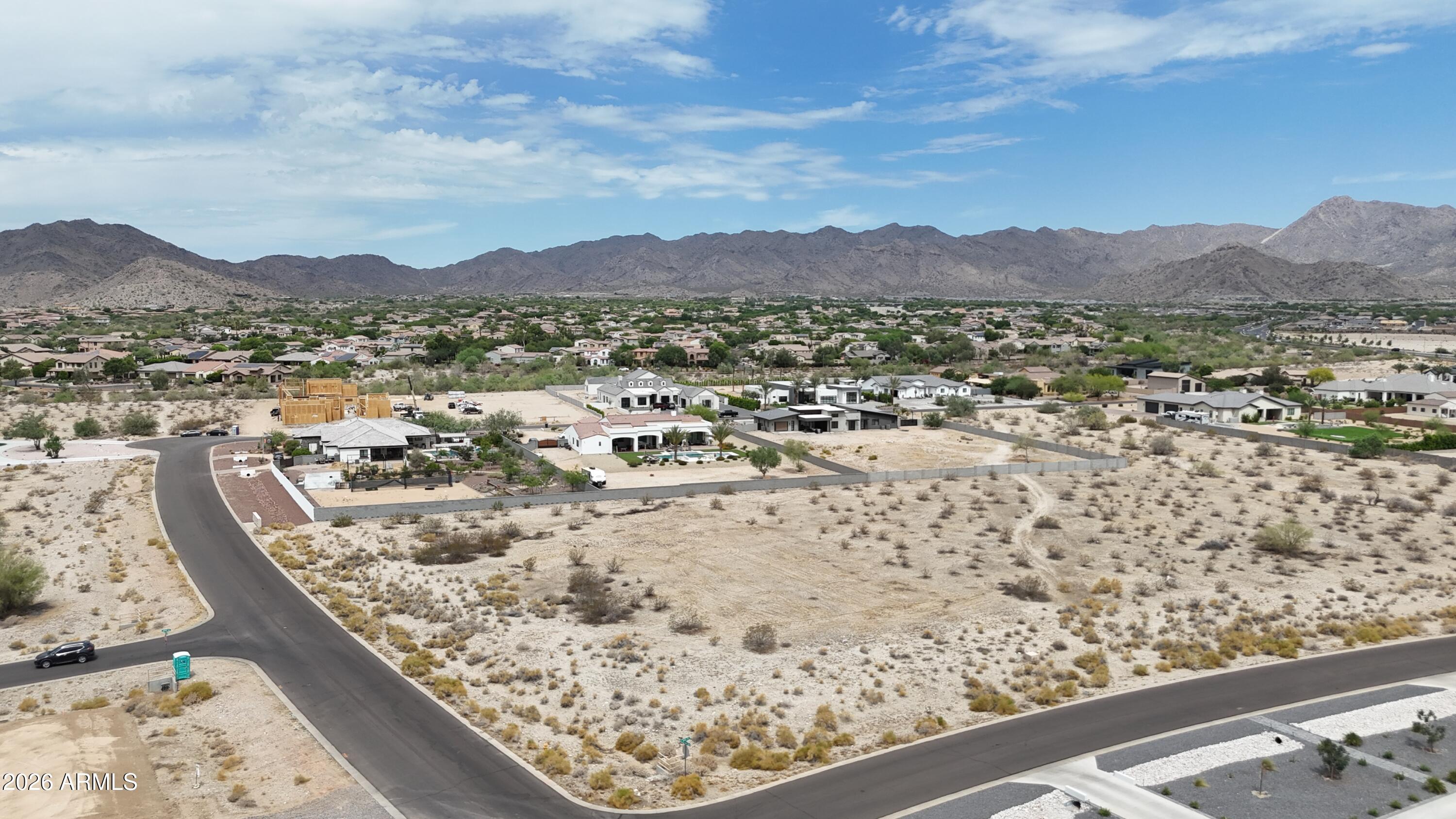 Located in the prestigious Pasqualetti Mountain Ranch community, this 1.33-acre custom homesite offers breathtaking White Tank Mountain views and the opportunity to build the home you've always envisioned. Surrounded by luxury custom estates ranging from $2M+, this desirable community is known for its privacy, peaceful atmosphere, and stunning desert landscapes. Enjoy the perfect balance of seclusion and convenience with easy access to shopping, dining, golf courses, hiking trails, and the rapidly growing amenities of Buckeye and Verrado. Bring your builder and create a one-of-a-kind custom residence in one of the West Valley's premier luxury communities. Don't miss this rare opportunity to own a premium homesite in Pasqualetti Mountain Ranch.