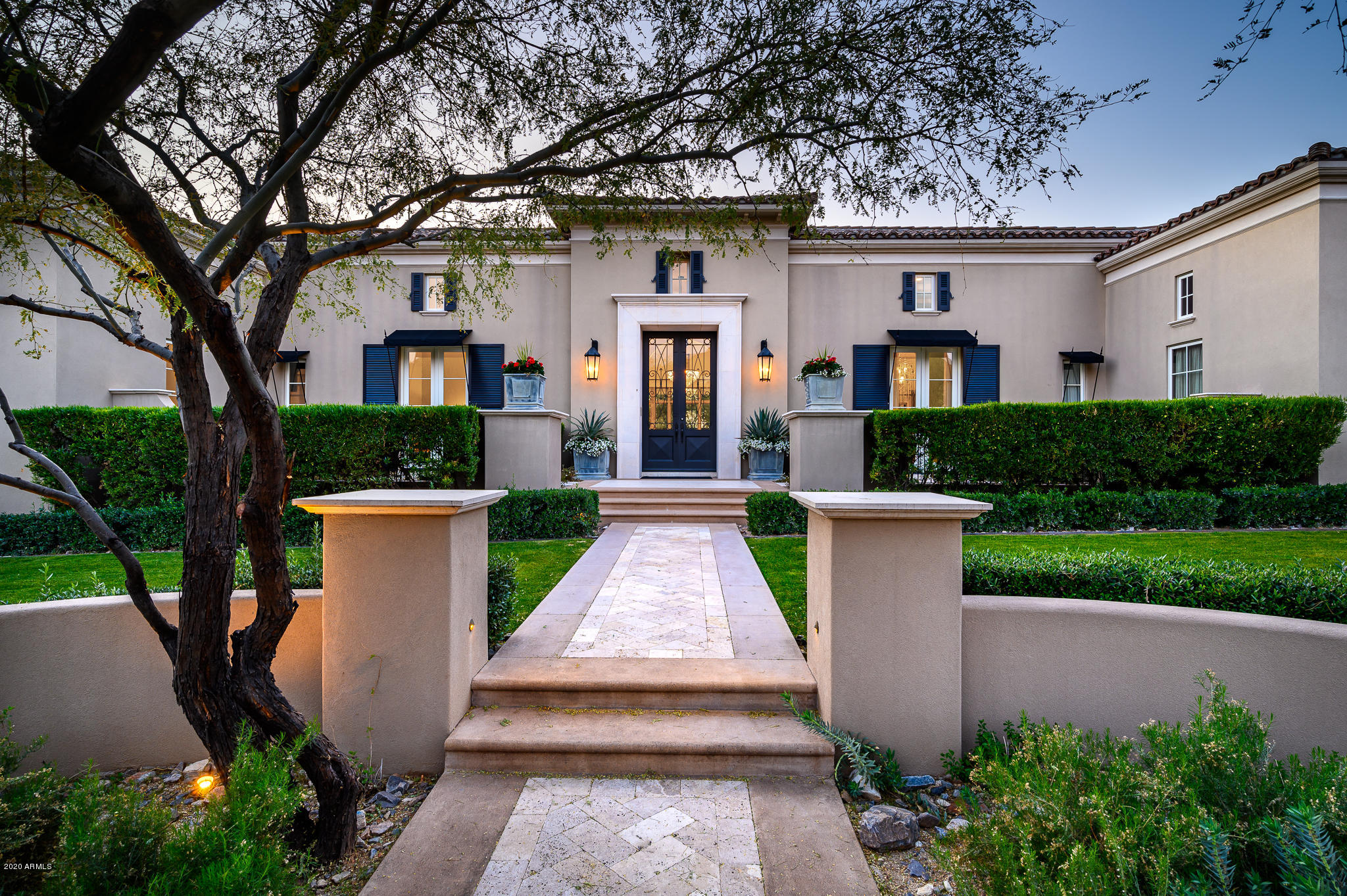 Located on the prestigious Silverleaf Club Circle in Horseshoe Canyon, this stunning estate is enveloped in privacy and lush grounds.  Experience the ultimate in outdoor living with a resort-style pool and spa, generous covered patios and dining areas, multiple fireplaces, and the perfect outdoor kitchen and bar for entertaining family and friends. Quality architectural details and finishes, along with an abundance of natural light create an elegant and sophisticated interior. The expansive, single-level living is sure to appeal to the most discerning. A thoughtful floor plan offers a great room featuring a glass wall opening to the outside, a cook's kitchen with marble countertops, and a spacious breakfast room flanked by a lavish dining room, wine cellar, and formal living area. The luxurious split master suite, adorned with a fireplace, sitting room, private outdoor patio, large walk-in closets, full-size laundry, and steam shower, offers ultimate indulgence.   An inviting office with built-in cabinetry, a den/television room, and ensuite guest rooms complete the main house living. A detached casita serves as a second master suite or game room with a large upper-level guest suite.