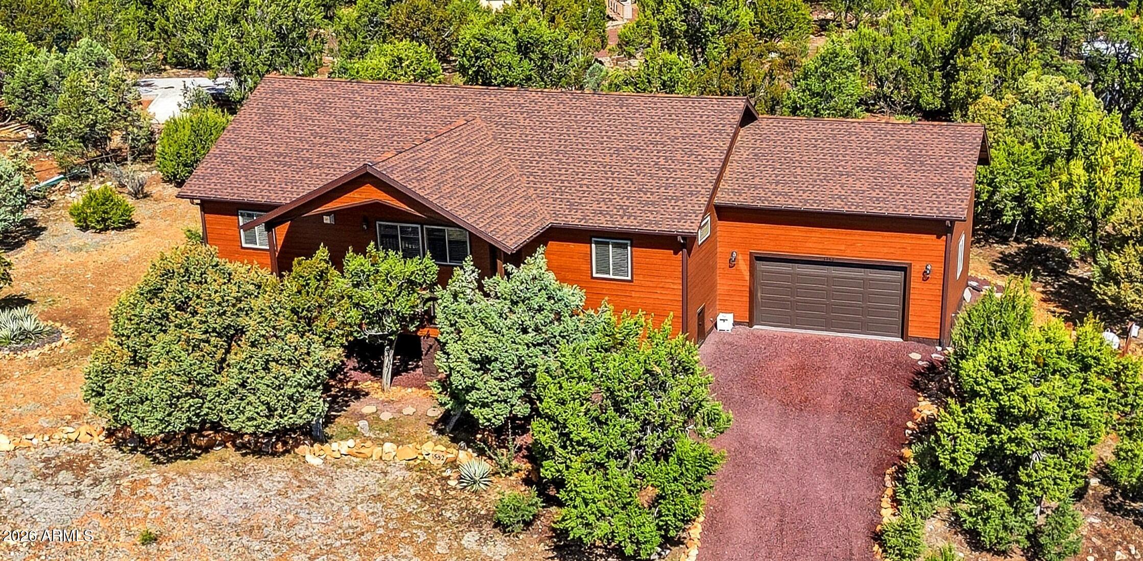 Gorgeous, Spacious, Built in 2021 and still looks Brand New!  You have to see this 1890 sf, 3 BR, 2 Ba home! The expansive great toom opens into a roomy kitchen and dining area.  Kitchen features SS appliances, an island, & granite counters.  All bedrooms are oversized with the master split from the 2 guest rooms and common bathroom. Ensuite master bath features a granite top, dual vanity & a beautifully tiled walk in shower. Mudroom features W/D, utility sink, and a storage closet. Fully insulated attached garage has electric opener &epoxy coated floors. Enjoy the magnificent views from the covered decks! Upgrades include high end LVP flooring, tons of closets, Trex decking, tongue and groove ceilings, alder interior doors, insulated subfloor, wooden blinds, gutters and much more!