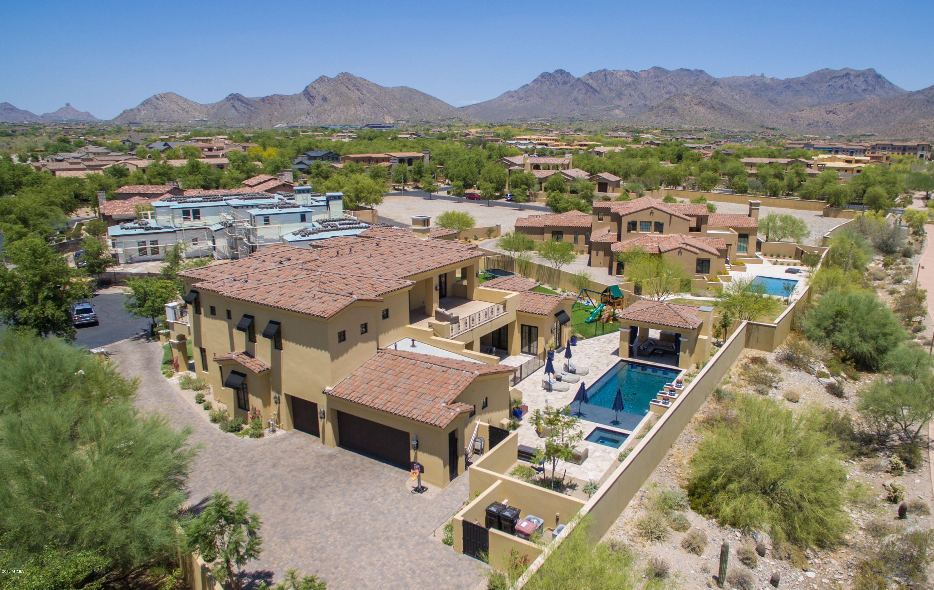 One of the Newest built home in the beautiful tree-lined community of Arcadia at Silverleaf. This 5,912 sq ft., modern Mediterranean, cul-de-sac lot offers mountain views, gorgeous sunsets and city lights. Flexible, open and light floor plan will suit your buyers specific needs. Distressed wood plank flooring throughout the home, with the exception of bedrooms. This property was designed with theater room, office/den, exercise room, library, children's play room (7th bedroom). Multiple covered patios w/firepits, sitting & dining areas, provide the ultimate in indoor/outdoor living experience. Large children's play area with turf, pool with swim-up bar/spa and several viewing balconies. The finest in construction and quality finishes.