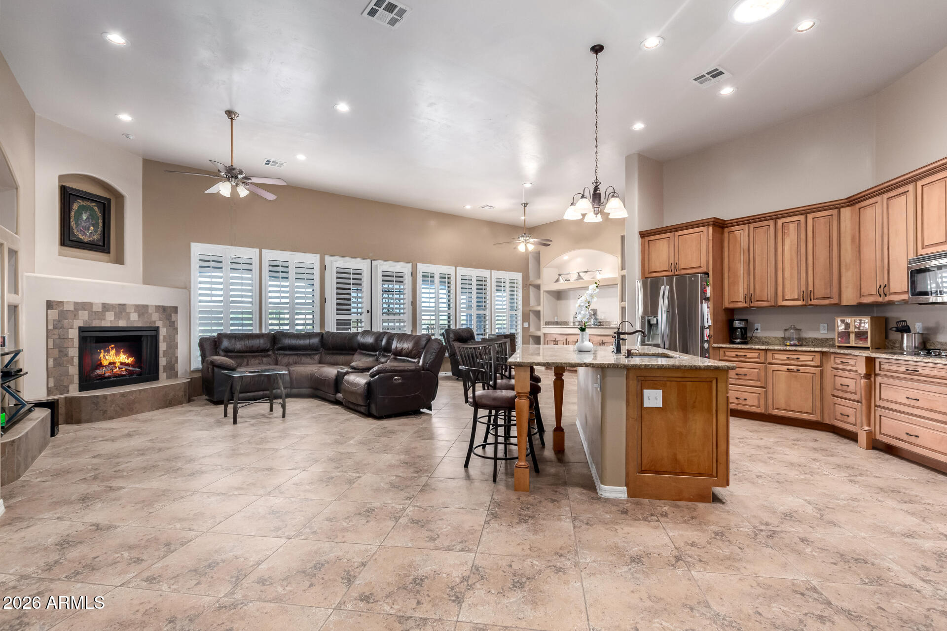 Discover refined country living in this custom single-family home on 1.325 acres-a sophisticated blend of space, style, and practical luxury. At 2,555 sq ft, the home features soaring 10-ft ceilings throughout, an expansive living room anchored by an electric fireplace and French doors that open to the patio, and a chef's kitchen with a beautiful granite island with live edge, custom cabinets, a generous walk-in pantry, and dishwasher--perfect for entertaining or everyday culinary life. The primary suite is a private retreat with French door access to the patio, a spa-style bath with a soaking tub and separate tiled walk-in shower, and a large walk-in closet. The intelligently designed split floor plan places guest bedrooms apart for privacy; two share a Jack-and-Jill bath while one guest room offers private backyard access and a walk-in closet. Practical amenities include a three-car garage with a new HVAC system, RV gate, RV hookup, and RV parking, a large laundry room with storage closet, and an included shed. With minimal neighbors and a welcoming small-town feel, the expansive yard is a blank canvas for a pool, workshop, or garden oasis- imagine the possibilities.