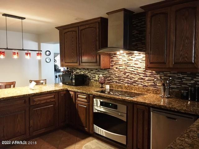 This home has an upgraded kitchen and baths with granite countertops and walnut cabinets. Offers 3 bedrooms, 2 baths an office/den that could be a 4th bedroom,  living room and family room, a good size laundry room,2 large storage workshops. Large lot (.51 acre) with RV gate. Rural feel but in town. Property is located behind UPS on hwy 90 and it's zoned commercial/residential. 
Home is vacant. Check it out!!