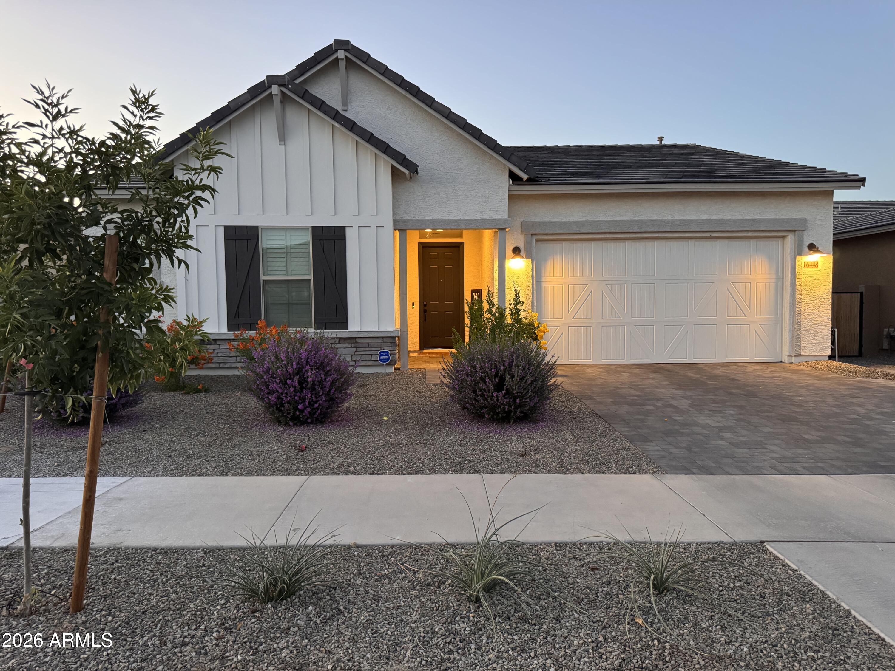 Welcome Home! The Topaz floor plan loaded with every upgrade imaginable!  This stunning 4BD/3BA + office & bonus room features 10' ceilings, 8' doors, and an open layout enhanced by a multi-slide door leading to an extended covered back patio.  Inside, enjoy wood-look tile, custom tile work, quartz countertops, tray ceilings and shutters throughout.  Every bedroom boasts a walk-in closet and designer touches.  The chef's kitchen offers an electric cooktop preplumbed for gas and double oven. The bonus room is transformed into a stylish lounge with a bar refrigerator.  Jack&Jill bath, polyaspartic garage floor, storage shelves and an 8ft garage door complete the package.  Step outside to a fully finished turf and paver backyard.  NO WORK NEEDED, close to Prasada. This one truly has it all!