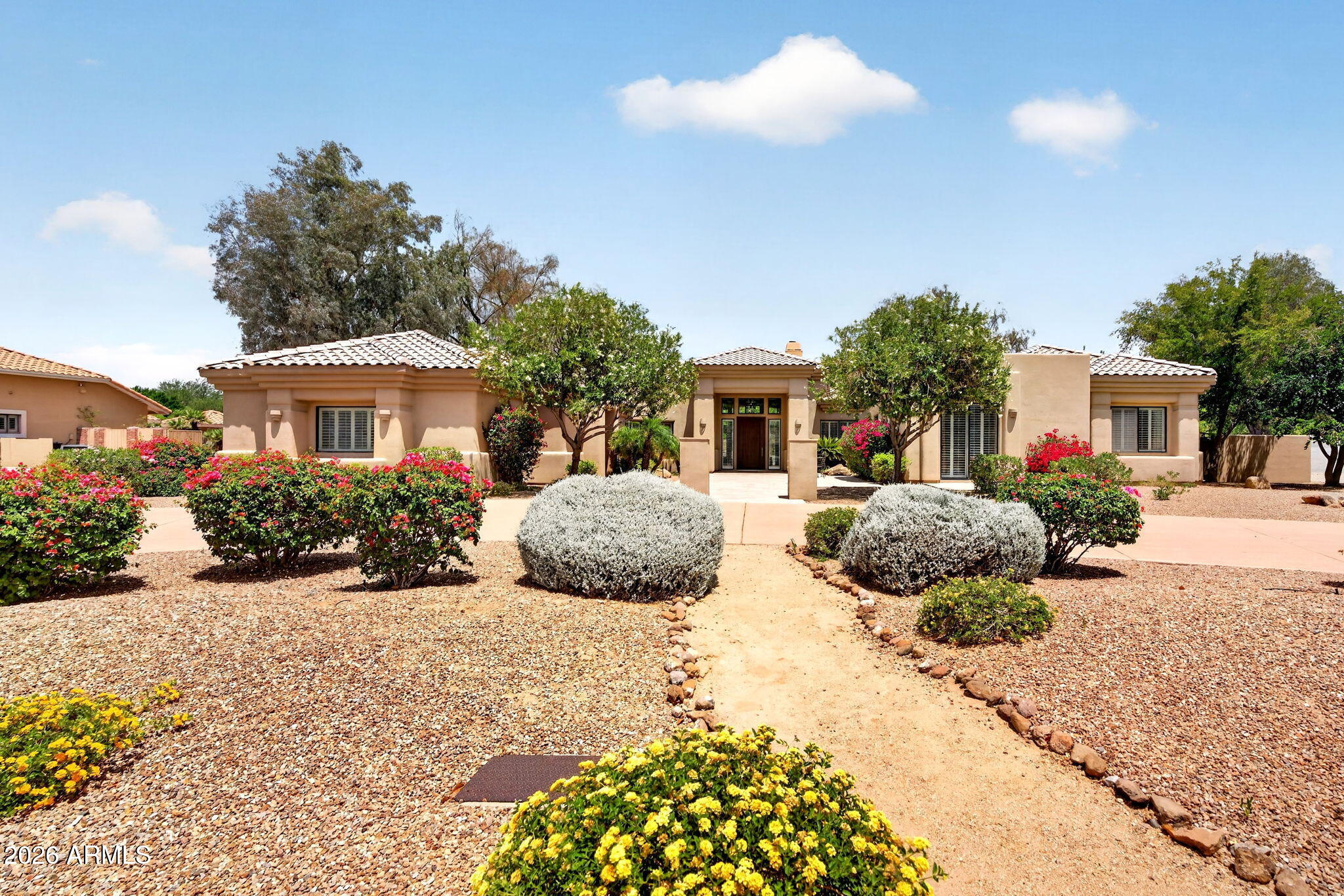 Tucked away on an oversized 0.81-acre lot with breathtaking mountain views, this custom home offers the perfect blend of privacy, space, & convenience in one of Glendale's best kept secrets, a unique hidden pocket known for its large lots, custom homes, & no HOA. Built & lovingly maintained by the original owners, this rare property was thoughtfully designed with both everyday living & entertaining in mind. Featuring 5 bedrooms, a dedicated office, 4.5 bathrooms, a finished basement with kitchenette, & a unique firepole connecting the main level to the basement, this home offers character & functionality you won't find anywhere else. Ideal for multi-generational living, the finished basement with kitchenette creates the perfect setup for extended family, guests, teens, or a private retreat The expansive property offers endless flexibility with ample room for RV parking, toys, future additions, or simply enjoying the privacy and open space this hidden neighborhood is known for. Designed for Arizona living, the backyard features a sparkling pool, bocce ball court, stunning mountain views, & plenty of space to relax or entertain year-round. Located near top-rated schools, hiking trails, shopping, dining, & the exciting growth happening throughout Peoria & North Glendale, this is a rare opportunity to own a truly unique custom home in an increasingly sought-after area.