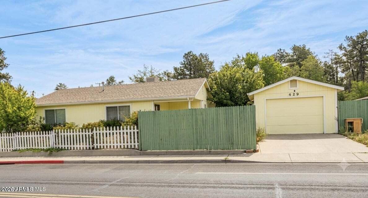 Recently remodeled and ideally located just minutes from downtown Prescott, this charming 3-bedroom, 2-bath home offers both convenience and versatility. Tile flooring flows throughout the home, complementing the bright and welcoming living spaces. The lovely kitchen opens to a comfortable dining area, perfect for everyday living or entertaining. Enjoy the rare benefit of two separate driveways—one off Gayle Gardner Way and a second from Paar Drive on the north side of the property. The secondary driveway offers potential small RV or additional parking, adding exceptional flexibility. Relax on the private front patio surrounded by low-maintenance landscaping, creating a peaceful outdoor retreat.