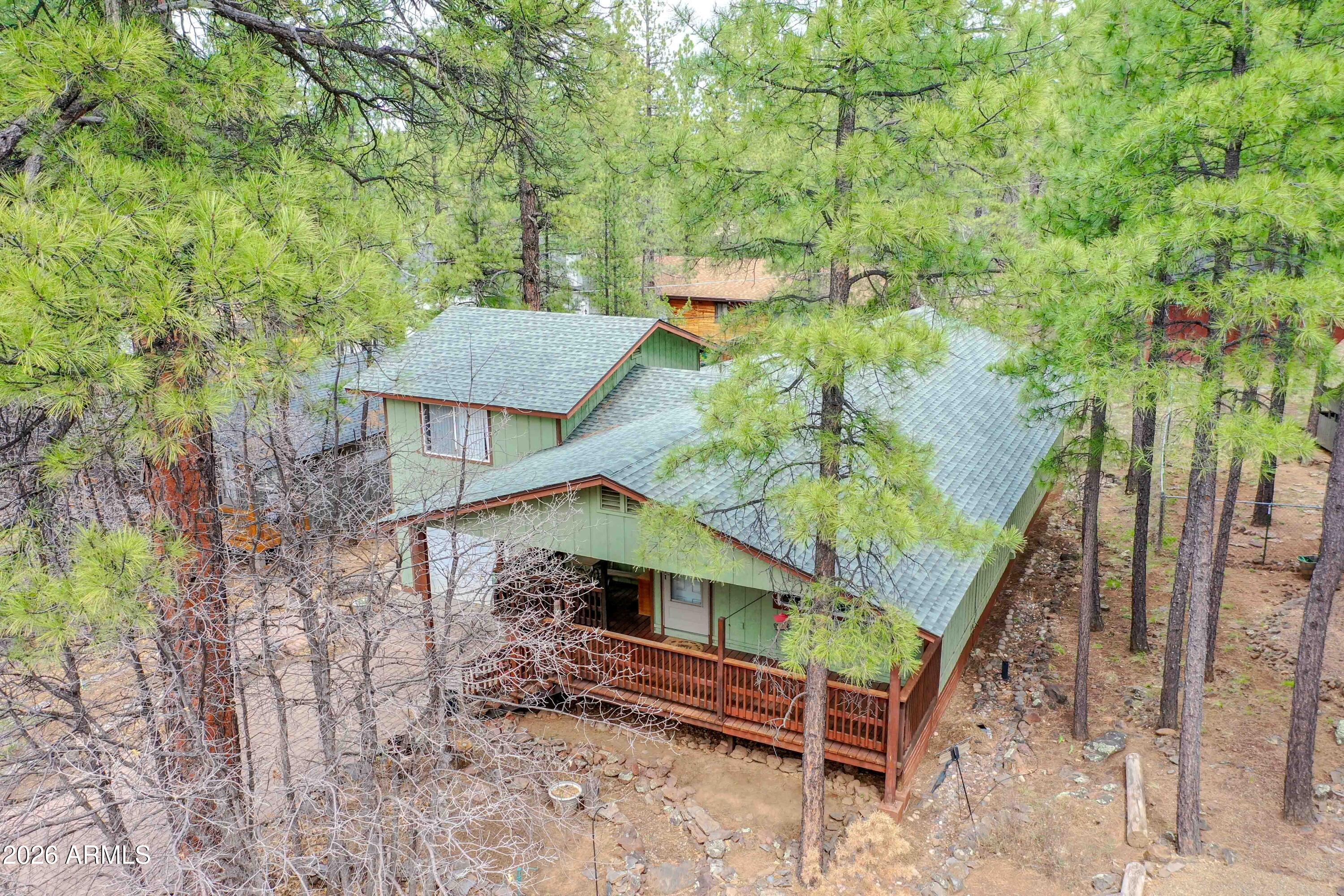 Charming 3 bed / 2 bath tri-level Munds Park cabin nestled in the pines! Located on Animal Hill, one of the most desirable areas of Munds.  This cozy retreat offers the perfect escape to the mountains with a peaceful, heavily treed lot and fresh forest air.

The property is being sold by its original owner and includes a one-car garage with plenty of space for your outdoor gear and toys, making it ideal for enjoying all the nearby recreation. No HOA, giving you the freedom to truly enjoy your cabin getaway.

Conveniently located just minutes from the National Forest, Lake O'Dell, and Pinewood Golf Course, this home is perfectly situated for hiking, fishing, golfing, and year-round outdoor adventure. Optional membership is also available at Pinewood Country Club for those who want to enjoy additional community amenities.    


***NEW ROOF INSTALLED IN 2025***