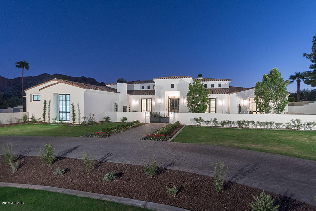 New Construction! A beautiful Transitional Santa Barbara Estate that is beyond compare. This professionally designed home is set on a gorgeous homesite with fabulous Paradise Valley mountain views captured both indoors and out.  The expansive glass, soaring ceilings and incredible living spaces combine for the ultimate living experience.  There are 5 bedrooms and a den with an incredible bonus room and bespoke bar area.  The kitchen features double islands topped in Arrabescoto marble, Wolf appliances, a butlers pantry and so much more.  The great room leads to the ultimate patio setting.  Outdoors you'll enjoy the custom pool and spa blending harmoniously with the professionally designed landscaping.  There's a garage storage room and energy saving foam insulation throughout. Call now!