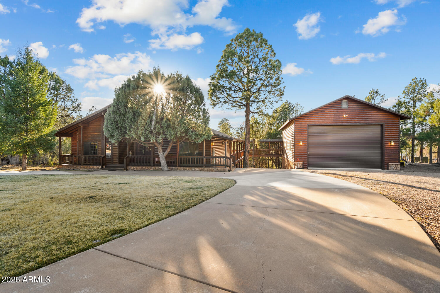 This one owner custom built log sided home is the perfect place to start building new family memories.  The 3,734 sq. ft. home with a brand new roof features 4 bedrooms, 3 baths plus a family friendly kitchen and open great room with a beautiful fireplace.  Plenty of outdoor living on the spacious, covered wrap around deck.  The fully finished daylight basement will add to the enjoyment with its full bar, TV and games area and a full bath.  This property also has a 1,500 sq. foot detached garage with breezeway to the home and the basement area also has a garage space for toys and more storage.  The level 1 acre lot is full of mature pines trees and lovely landscaping.  Best yet, , the home is being sold fully furnished and there is NO HOA.
Come see this one of a kind home today.