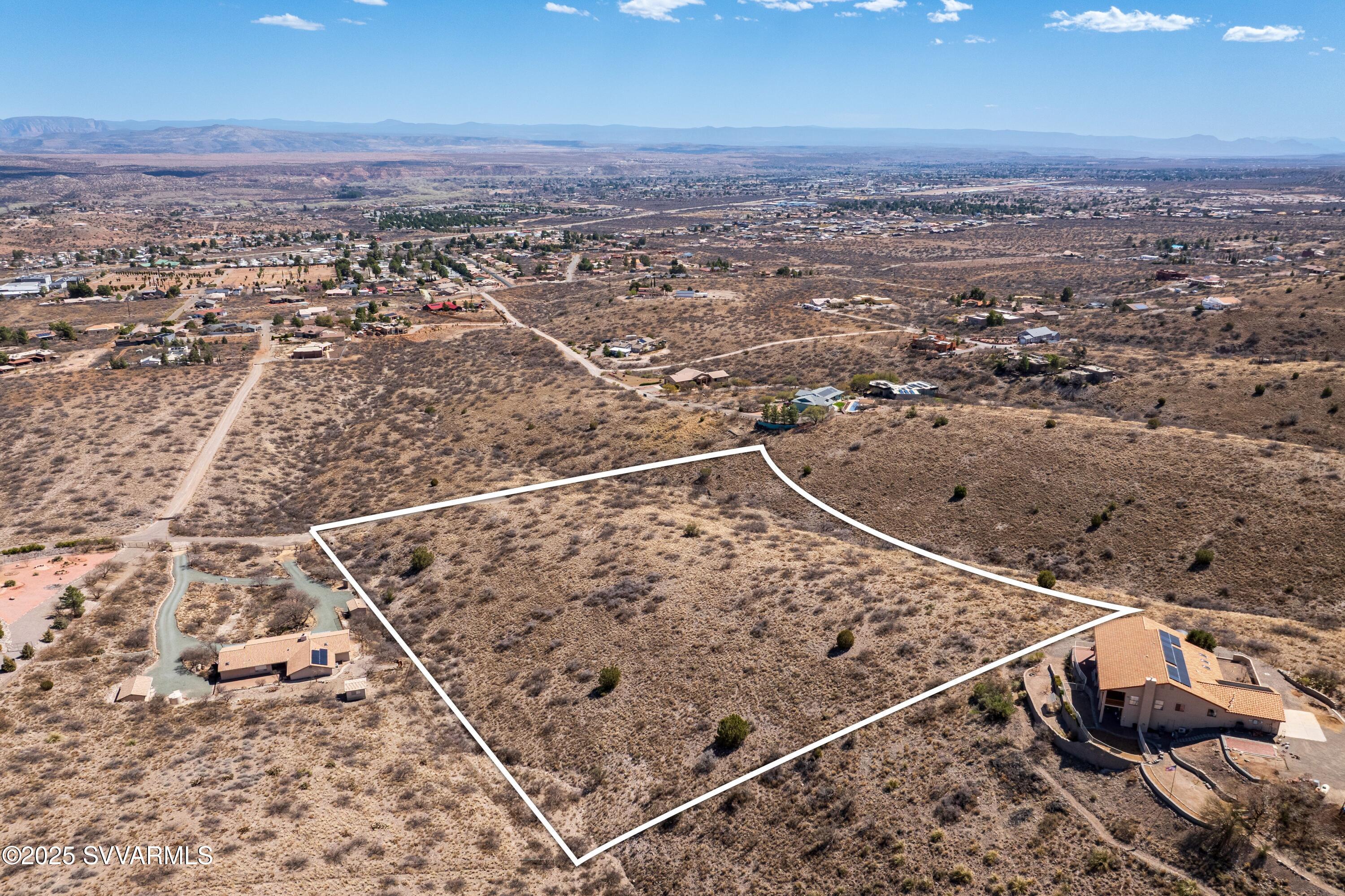 Gorgeous one-of-a-kind 6 acre parcel of land located in the foothills of Clarkdale. This large splitable lot has a gentle slope and borders Prescott National Forest on the top side! Seller purchased this lot to build her dream home on it and life happened. There is a dirt dedicated road to the lot and plenty of parking so you can experience the lot and all of it's views and beauty easily. Survey will be attached to listing ASAP. No HOA. 

Clarkdale is a wonderful little community with lots going on including the Concerts in the Park during the summer months, kayaking on the Verde River, Fourth of July Parade and Festivities, Made in Clarkdale Art Show, the Verde River Railway, and so much more.
