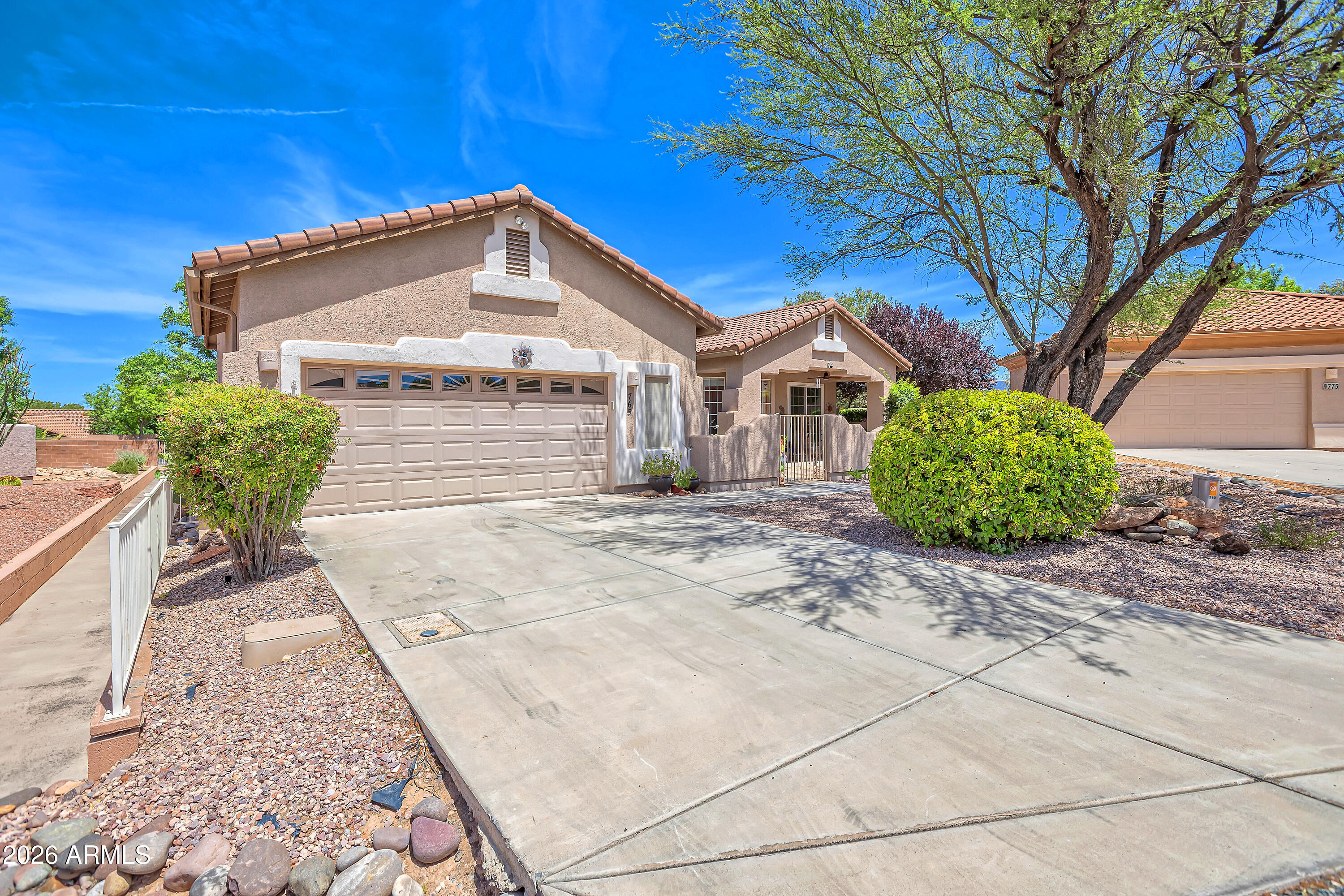 Welcome to easy living in the highly desirable 55+ community  at Verde Santa Fe. A spacious split floorplan offers 3 bedrooms plus a separate den, creating flexibility for guests, a home office, or creative space. 

Beautiful tile flooring in the main area, while the tastefully remodeled kitchen features quartz counters,  new appliances and updated finishes designed for both comfort and style. A new washer and dryer are also included.

Enjoy peaceful mornings with coffee on one of the covered patios, front and back, in a private setting for relaxation and outdoor enjoyment. Ideally situated on a quiet cul-de-sac, this home offers a graceful, low-maintenance lifestyle within a welcoming community atmosphere. also close to the iconic red rock beauty, hiking, and recreation of Sedona.
