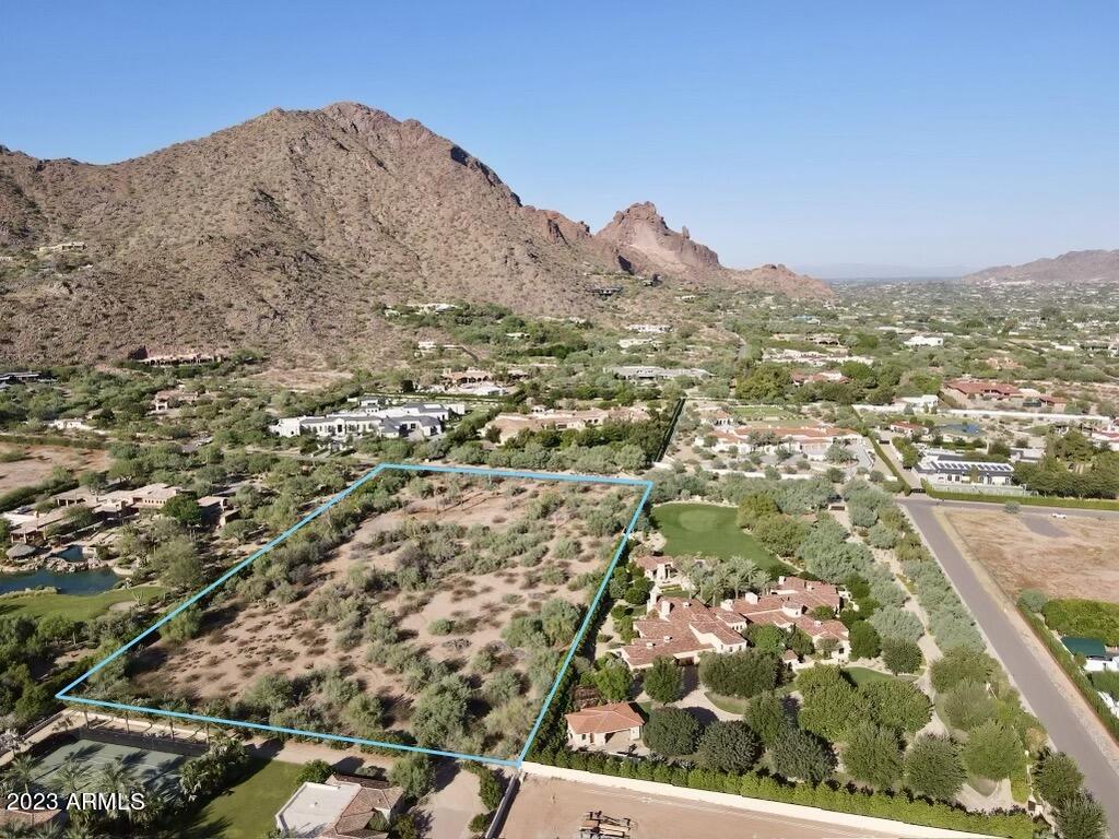 Surrounded by Arizona's most prominent properties, this is the opportunity to create the most prestigious estate in Paradise Valley. The location, acreage and address demand the most refined and extraordinary vision. 
Rarely does land this scarce and desirable become available. Situated on 4.96 acres in the heart of Paradise Valley along Billionaire's Row, this flat lot offers seclusion and privacy while also capturing premium mountain views of Camelback, Mummy, McDowell, and Four Peaks. 
Nestled closely to the finest resorts, spas, and restaurants in Arizona, with unimpeded views of the iconic Praying Monk. 
51,585 SF under roof architectural plans from internationally renowned Architect Bing Hu, hardscape plans, surveys, and soil reports convey. Seller will accept Bitcoin.