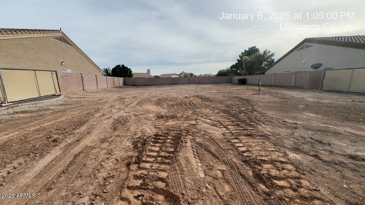 Vacant lot with existing water meter and sewer connection.