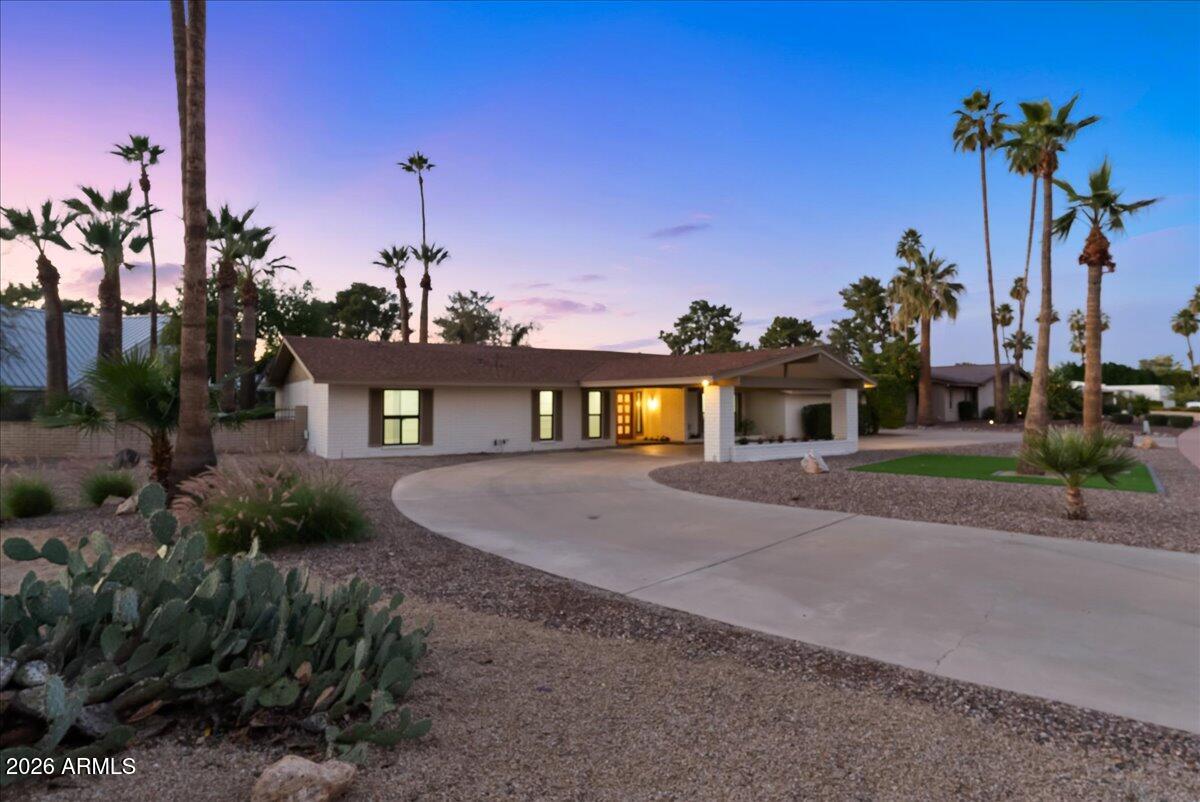 ''Priced below appraisal value.'' Step into refined luxury living in this fully remodeled ranch-style estate, perfectly positioned in the highly sought-after Old Litchfield Park community on the 14th hole of the Wigwam Gold Golf Course. This home blends timeless elegance with modern design, offering breathtaking golf course and sunset views that elevate everyday living.
Spanning approximately 2,900 square feet, this exceptional residence features 4 spacious bedrooms and 3.5 beautifully appointed baths. The expansive great room flows seamlessly into a show-stopping open kitchen, designed for both entertaining and everyday comfort. Highlights include a massive waterfall-edge island, striking stone countertops and full backsplash, gas range, and a dramatic stone gas fireplace anchoring the space. A designer wine room with custom tile adds a sophisticated touch, perfect for hosting and showcasing your collection. Retreat to the luxurious primary suite, where spa-inspired finishes await an oversized soaker tub, an elegant tiled shower with dual rain shower heads, a private water closet, and a custom designer closet that completes the experience.
Throughout the home, white oak wood flooring and thin-shaker oak cabinetry deliver warmth and understated luxury. Outside, enjoy Arizona living at its finest with a large covered patio, resort-style pool, and unobstructed golf course views ideal for relaxing evenings and unforgettable sunsets.
Set on an impressive almost half-acre lot, the property also features a grand half-circle driveway and a porte-cochère entry, adding both curb appeal and convenience.
This is a rare opportunity to own a luxury golf course home in one of the West Valley's most iconic neighborhoods where elegance, comfort, and lifestyle come together seamlessly.