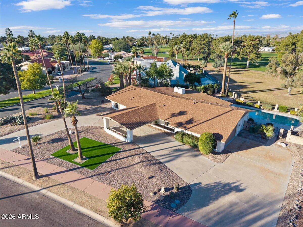 ''Priced below appraisal value.'' Step into refined luxury living in this fully remodeled ranch-style estate, perfectly positioned in the highly sought-after Old Litchfield Park community on the 14th hole of the Wigwam Gold Golf Course. This home blends timeless elegance with modern design, offering breathtaking golf course and sunset views that elevate everyday living.
Spanning approximately 2,900 square feet, this exceptional residence features 4 spacious bedrooms and 3.5 beautifully appointed baths. The expansive great room flows seamlessly into a show-stopping open kitchen, designed for both entertaining and everyday comfort. Highlights include a massive waterfall-edge island, striking stone countertops and full backsplash, gas range, and a dramatic stone gas fireplace anchoring the space. A designer wine room with custom tile adds a sophisticated touch, perfect for hosting and showcasing your collection. Retreat to the luxurious primary suite, where spa-inspired finishes await an oversized soaker tub, an elegant tiled shower with dual rain shower heads, a private water closet, and a custom designer closet that completes the experience.
Throughout the home, white oak wood flooring and thin-shaker oak cabinetry deliver warmth and understated luxury. Outside, enjoy Arizona living at its finest with a large covered patio, resort-style pool, and unobstructed golf course views ideal for relaxing evenings and unforgettable sunsets.
Set on an impressive almost half-acre lot, the property also features a grand half-circle driveway and a porte-cochère entry, adding both curb appeal and convenience.
This is a rare opportunity to own a luxury golf course home in one of the West Valley's most iconic neighborhoods where elegance, comfort, and lifestyle come together seamlessly.