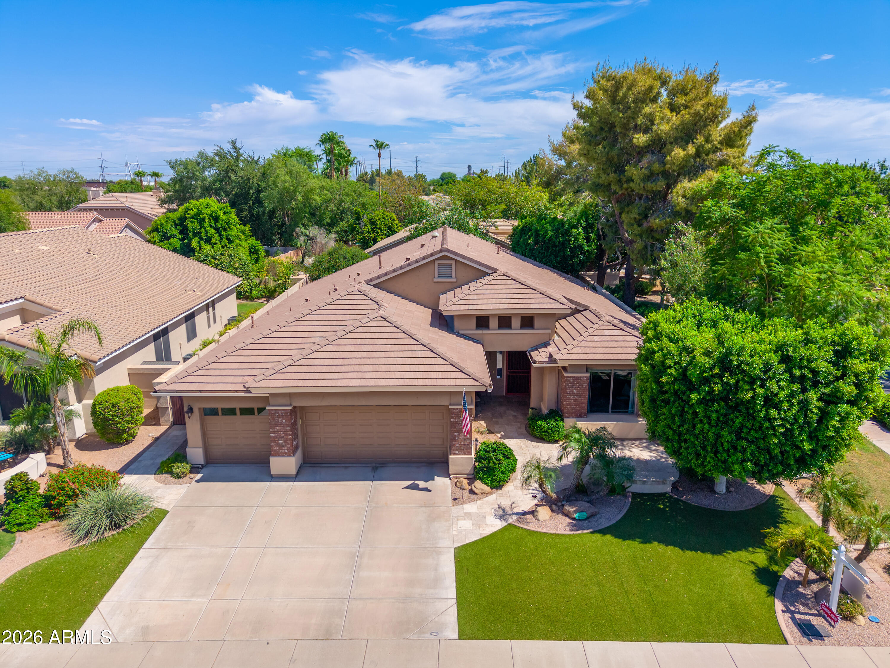 Located in Beautiful Alisanos Subdivision! -one of South Tempe's most sought after Gated Communities, this Gorgeous 3-Bedroom/ 2.5 Bath  plus Den sits on a premium corner lot & across the street rom the Community Park!  This Lovely open floor plan features hardwood and travertine flooring,  Tall ceilings abundant natural light, a gourmet kitchen with a Wolf /gas cooktop & modern hood, Large island- breakfast bar & plenty of 42'' Hardwood Cabinets. Split Floor plan- Primary has talrenovated ensuite bathroom.- Large tiled zero entry shower, double sink vanity, large closet. Step outside to beautifully lush landscaped backyard complete with mature trees, a tranquil fountain & built-in BBQ--Perfect for entertaining & relaxing. Exceptional home-Amazing location! Coveted Kyrene School district! Features:
New Roof, October 2025
Zero Grade entry door
Security doors front and back of home
Viking Cook Top range
Hand Scraped wood floors and Travertine
Roll in or Accessable Shower with Hot/Cold Manifold in shower
RO System
Soft Water System
5' Dimplex Electric fireplace
Wifi Closet with extra storage space
Granite countertops
Gas BBQ Grill