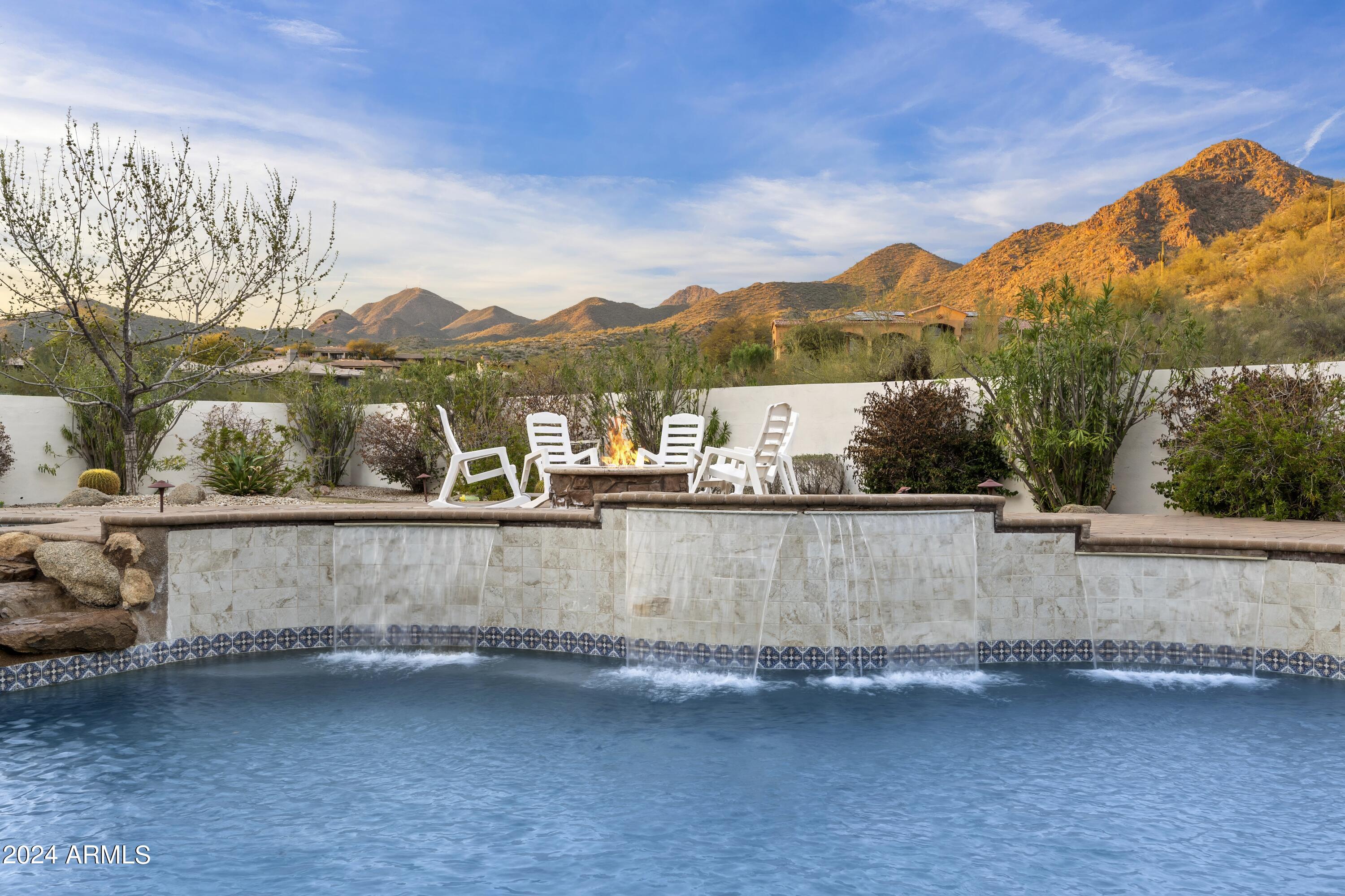 This beautiful custom home sits at the end of a cul de sac in prestigious Sabino Norte in North Scottsdale. a+ curb appeal combined w/a flawless floor plan make this a premium offering. Layout features formal living/dining rooms, massive family room adjacent to the chef's kitchen & wet bar, media room, 4 en suite bedrooms, exercise room, and home office.  High ceilings throughout w/beams, coffers, & many other custom details.  Upgrades are everywhere from the stone & hardwood floors, custom alder cabinetry, slab granite counters, Viking Pro appliances, 1000 bottle wine room, Canterra fireplace surrounds & columns, barreled ceiling w/brick inlay, custom light fixtures, too much to list. Other under the skin updates include all new Trade AC units in 2020, new roof in 2019, & owned solar system. Back yard features a massive covered patio overlooking large pool & spa w/boulder water fall, grassy play area, fire pit, fireplace, paver deck, b-in bbq, and awesome mountain & sunset views.  Ideal location minutes to Basis & Desert Mountain High School as well as Mayo Clinic & shopping/dining options. This home has to be seen in person to appreciate as it is a fantastic package for the list price.