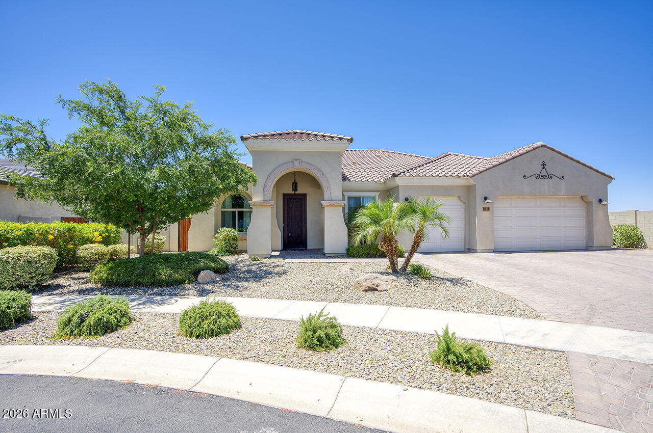 UNICORN ALERT! Fantastic single level home on a huge almost 1/2 acre lot in a prestigious gated community. Fall in love with this open floor plan! Perfect set up with a den/office up front and formal room but then the main living is open and bright with a stunning island kitchen with top of the line appliances and lots of storage. The living room looks out on the expanded covered patio and stairs to up top balcony with amazing South Mountain and downtown Phx views! The lot is incredible, with plenty of space to build a guest house, pool, heck, why not both?! There is room! This home is well appointed and you can tell the quality of the build. Super quiet gated community with nice common space and playground. This are is really booming, come find out why! A true 10+ Home!