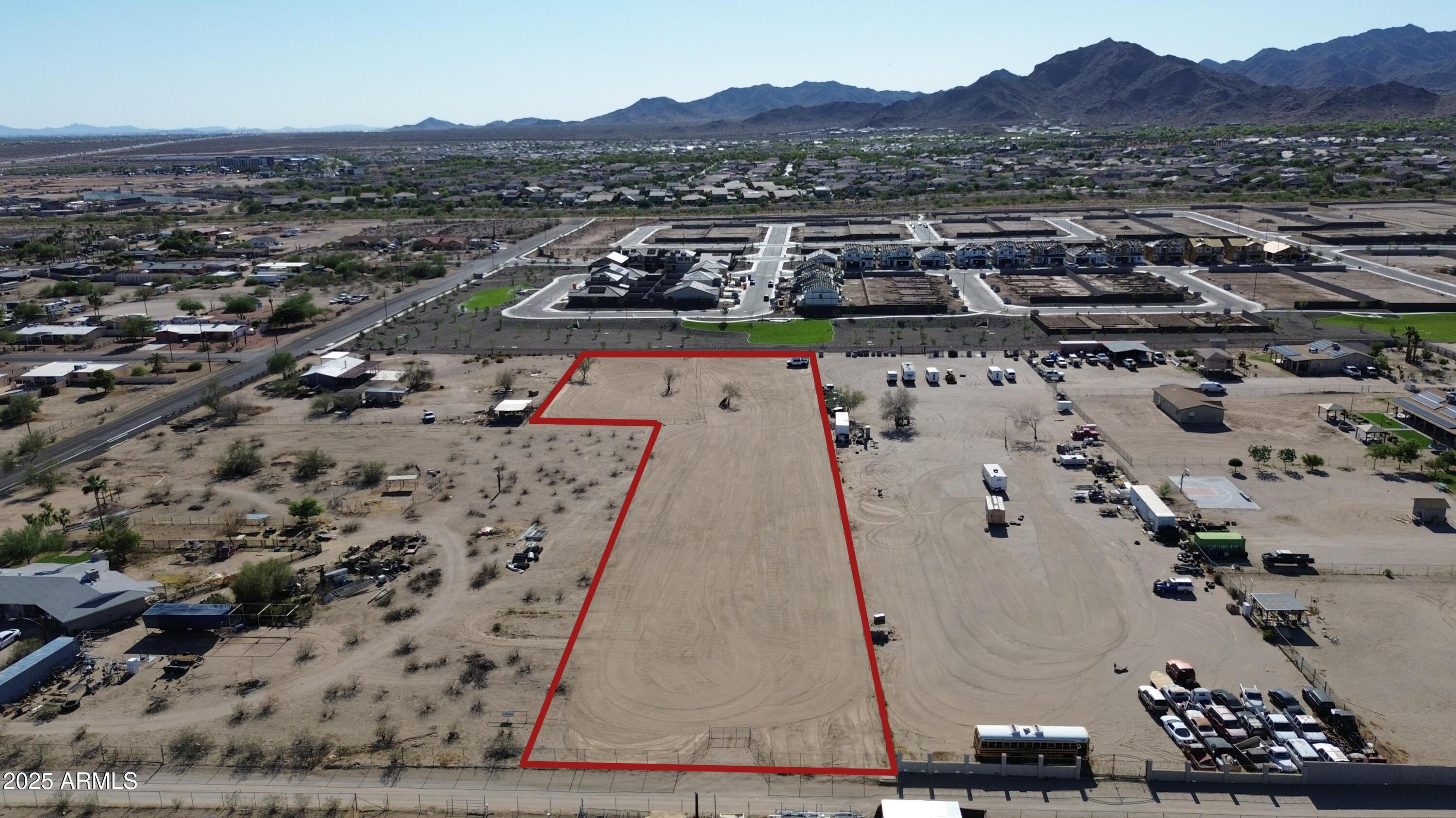 The perfect 2.34-Acre Lot with Stunning White Tank Mountain Views! A rare opportunity to own a prime homesite in the highly sought-after Valencia Heights! This ready-to-build lot offers breathtaking views of the White Tank Mountains and borders Verrado, providing the perfect blend of privacy and accessibility. Don't miss your chance to create your dream home in this desirable location!