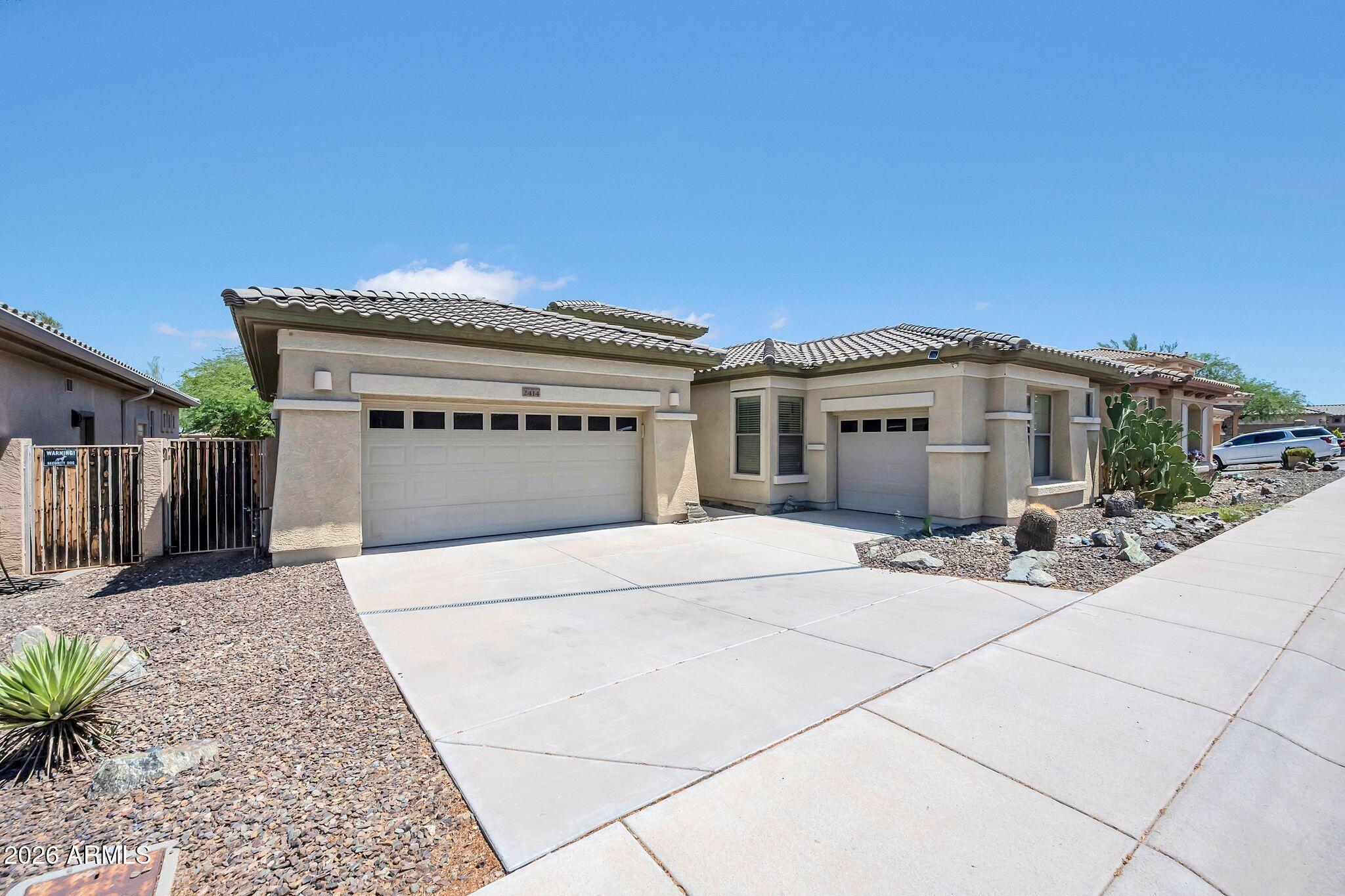 Beautiful turn-key single-level home just minutes from South Mountain Park! Offering nearly 2,500 sq ft, this spacious 4-bedroom, 2.5-bath home features soaring ceilings, an open and functional floor plan, wood-look tile flooring throughout, and no carpet.The kitchen is designed for both everyday living and entertaining with a gas cooktop, wall oven, center island, abundant cabinetry, and a walk-in pantry. The split primary suite offers privacy, dual walk-in closets, dual vanities, and a separate tub and shower. Enjoy multiple living spaces including a family room, den, and formal dining area. The backyard is perfect for Arizona living with a large covered patio, custom outdoor fireplace, paver seating area, and view fencing. Furniture available by separate bill of sale.