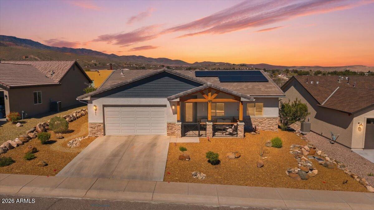 PRICED DRAMATICALLY BELOW MARKET VALUE!  It's almost too good to be true--custom upgrades, green energy, nearly new, and jaw-dropping Sedona views at an unbelievable price. This Energy Star Hybrid Home delivers luxury living with breathtaking views, and unmatched efficiency. Sweeping, unobstructed views of Sedona's iconic red rocks, Mingus Mountain, and Sycamore Canyon, this meticulously maintained residence offers a rare blend of elevated design, quality construction, and true cost-saving performance. With an ultra-low HERS rating of 14, enjoy the benefit of virtually no electric bill--a level of efficiency that's nearly impossible to find. A private, view-fenced front porch welcomes you into a bright, thoughtfully designed split floor plan filled with natural light from expansive windows and transom accents. Inside, a refined, cohesive aesthetic showcases clean lines, premium materials, and carefully curated finishes throughout.

The kitchen is a true showpiece--featuring solid knotty alder cabinetry with soft-close drawers, thick granite countertops, custom backsplash, and a full suite of all-new premium Bosch stainless steel appliances. Smart design elements like staggered cabinets, multiple Lazy Susans, and a deep basin sink enhance both beauty and everyday functionality.

The primary suite offers a peaceful retreat with a spacious walk-in shower, penny tile flooring, and a waterfall shower head. Both bathrooms are upgraded with executive-height vanities, custom wood-wrapped mirrors, enhanced fixtures, and added storage.

Throughout the home, you'll find luxury vinyl plank flooring, two-tone paint, paneled interior doors, whole-house shutters, and thoughtfully placed lighting. Unique touches like a frosted glass barn door and custom floating shelves add character while maintaining a modern, upscale feel.

Built with durable 2x6 construction, this high-performance home also includes a 3.48 kW owned solar system, EPA Indoor airPLUS certification, tankless gas water heater, Nuvo softener, reverse osmosis, whole-house filtration, Wirsbo plumbing system, and a built-in fire sprinkler system--delivering long-term efficiency, comfort, and peace of mind.

Outdoor living is equally impressive with an expansive backyard featuring mature shade trees, lush turf, and plenty of space to relax or entertain--all set against stunning panoramic views. A gas stub for grilling and pre wiring for a hot tub add even more versatility.
PRICED TO SELL, this move-in ready home represents one of the best values on the market--combining luxury finishes, energy efficiency, and unforgettable views. Opportunities like this are rare--and at this price, it won't last.
