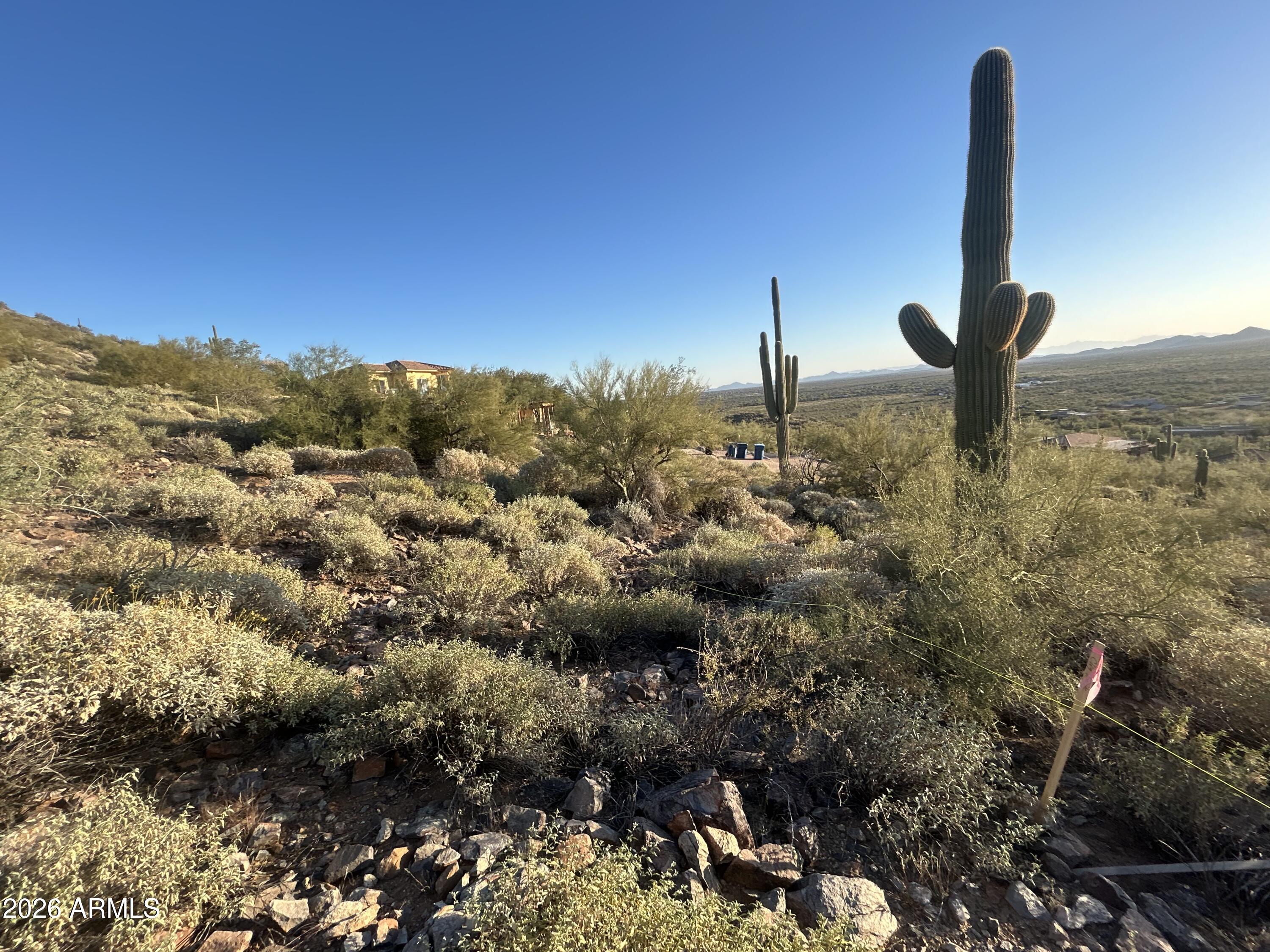 Unbelievable Custom lot just north of Carefree Hwy on the gentle slope of the mountain with waterl and electric.BORDERS CAVE CREEK REGIONAL PARK.    Beautiful desert plants  Exceptional build Ready Hillside Oasis with ACTIVE PERMIT  It is fully permitted,shovel ready legacy property.  The seller has invested over $200,000 in professional architectural design.   LOOK IN DOCUMENTS FOR MORE INFO
VIEW OF ANTHEM AZ AND LIGHTS OF PHOENIX MOUNTAIN  in the back is a REGIONAL PARK with no structures or roads.  Very private and secluded.  GORGEOUS VIEWS  ONE OF A KIND  
OWNER MAY CARRY WITH A GOOD DOWN PAYMENT.    Multi million dollar homes in the neighborhood.  Dead end road. paver driveway
Can be built to suit. Plans available.   Close to Home Depot shops,and restaurants. Just a few miles to th