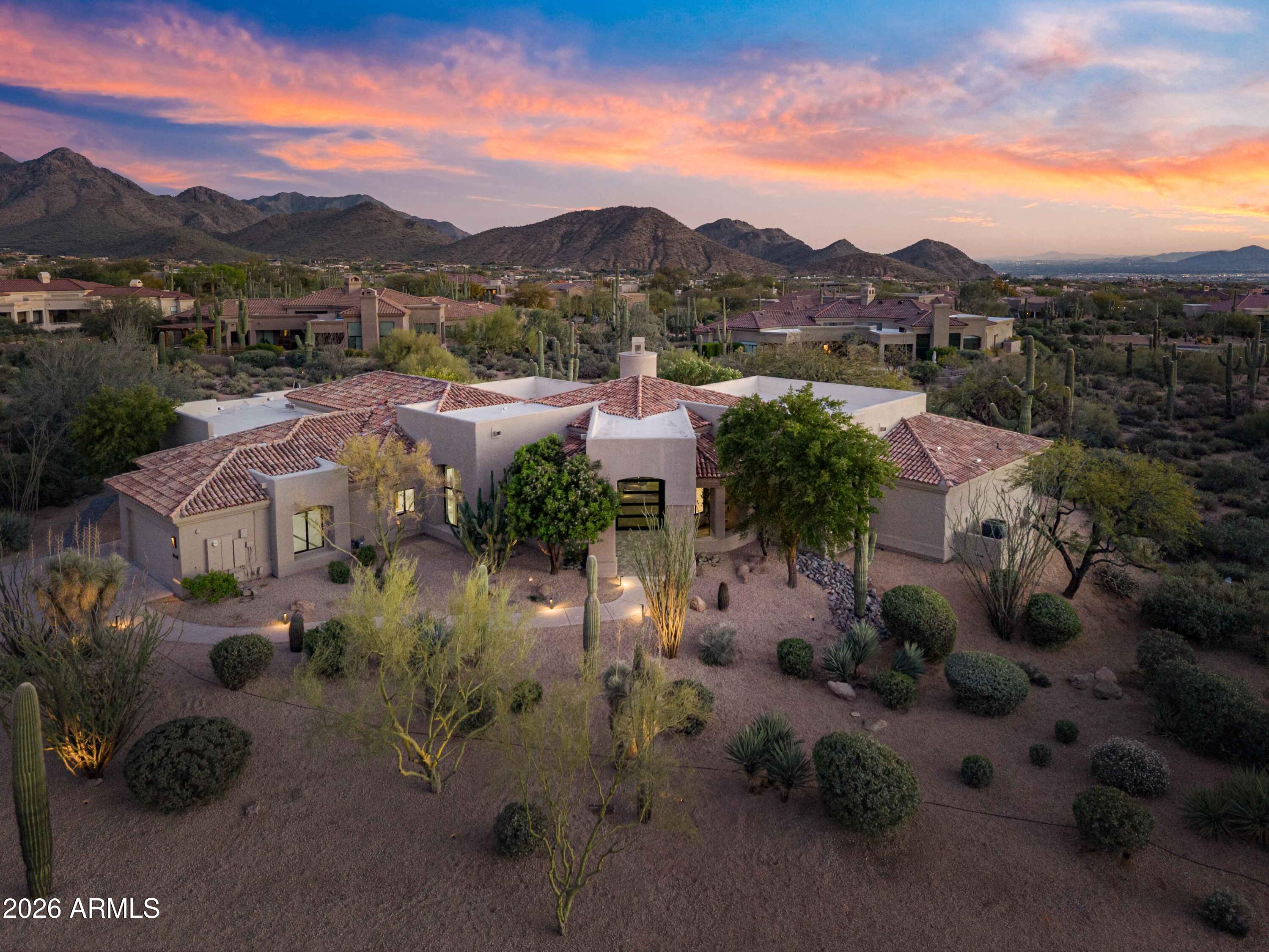 Experience elevated desert living in this meticulously reimagined home, located in the prestigious gated community of Eagles Glen. Nestled on a generous lot of nearly an acre, this home blends contemporary sophistication and timeless Sonoran beauty, featuring those Arizona sunsets and city light views from the south-facing back yard. Panoramic views of Pinnacle Peak to the front and Troon Mountain to the east that you can see from the sun drenched sparkling pool. 

The remodeled interior is sophisticated and seamless. Once you enter the glass, iron pivot door you will find a bright, airy open floor plan defined by engineered hardwood flooring, modernized smooth-textured walls, and custom ceiling beams in the family room. A sunny glass-walled office sitting just off the main living room. The chef's kitchen and entertainer's bar are the heart of the home. Featuring slim-shaker cabinetry, a custom hidden range hood, and granite countertops that extend into a full-height backsplash. Premium appliance package includes a full suite of GE Monogram appliances, including a 48" gas stove and 42" built-in refrigerator. The bar is perfect for hosting, it features a unique folding window for indoor-outdoor flow and a GE Profile beverage center.

The primary wing is a private sanctuary featuring new sliding doors to the patio. The spa-like bath boasts quartz countertops, designer sconces, and a stackable LG washer/dryer located right in the primary closet for ultimate convenience.