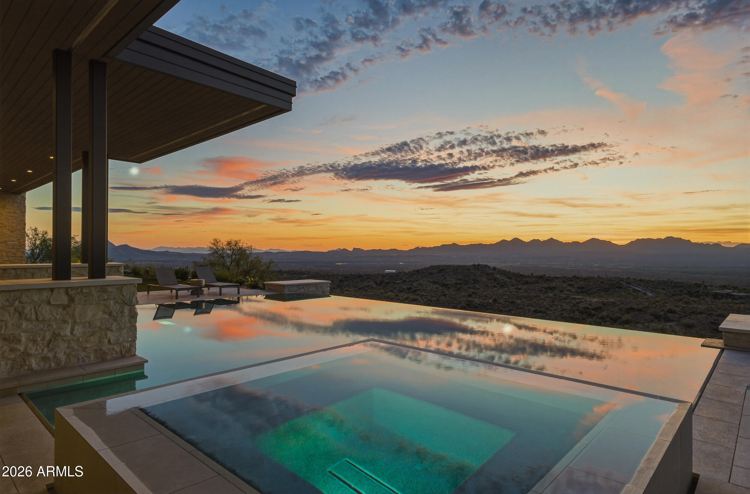 A rare opportunity to create a true masterpiece of design and craftsmanship, this warm modern ranch estate is to be built on 10 pristine acres in the Arizona Sonoran Desert, offering sweeping territorial views, exceptional privacy, and a remarkable connection to nature. Bordering the Tonto National Forest with direct access, the property opens to endless miles of riding, hiking, and exploration right from your doorstep .Envisioned as a fully realized design experience, every detail of the proposed residence is thoughtfully curated--from the rich textures of the flooring to custom cabinetry, designer countertops, and hand-selected fixtures. The home is designed to seamlessly blend natural materials, warm tones, and clean modern lines, creating a refined yet inviting desert retreat that harmonizes with its surroundings.Expansive living spaces, generous glass, and a carefully planned layout are intended to capture breathtaking desert panoramas while maintaining a sense of comfort and intimacy. The home will be delivered turnkey, with thoughtfully selected furnishings, art, and accessories  to complete the vision.The expansive acreage offers exceptional flexibility, with ample space for equestrian facilities, private riding trails with direct forest access, or a substantial shop or showroom ideal for a car collector. Buyers have the opportunity to tailor elements of the design to suit their lifestyle while maintaining the integrity of the overall architectural vision. This is more than a home--it is the opportunity to bring a fully realized lifestyle to life. Timeless, intentional, and truly one of a kind.