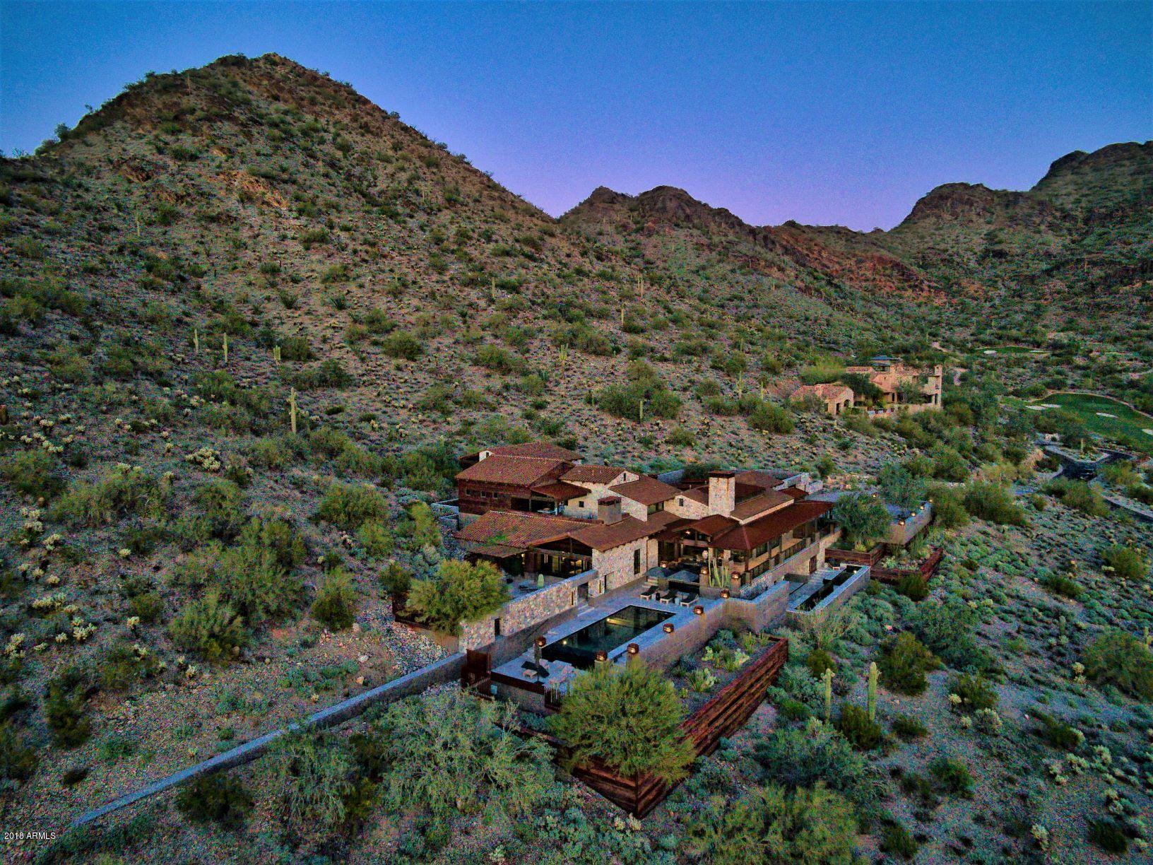 Architecturally stunning hillside Contemporary on 4 acres!  Home is perched high in The Ridge, a five-home enclave in DC Ranch which offers privacy and protected panoramic views.  The main level is comprised of dramatic living areas:  great room, chef's kitchen, home office, media room, wine cellar and master bedroom with private outdoor shower & spa.  2nd floor features loft study and two spacious guest casitas with private entrances sharing an upper terrace with fireplace, sitting, and dining area. Lower level includes full gym, steam room, bath and lockers- all taking in views of the lap pool and city lights.  Interiors by Turner Martin Design, composed of organic materials, indelible finishes and modern elements.  Home design by R.J. Bacon, and built by Archer Custom Homes in 2015.
