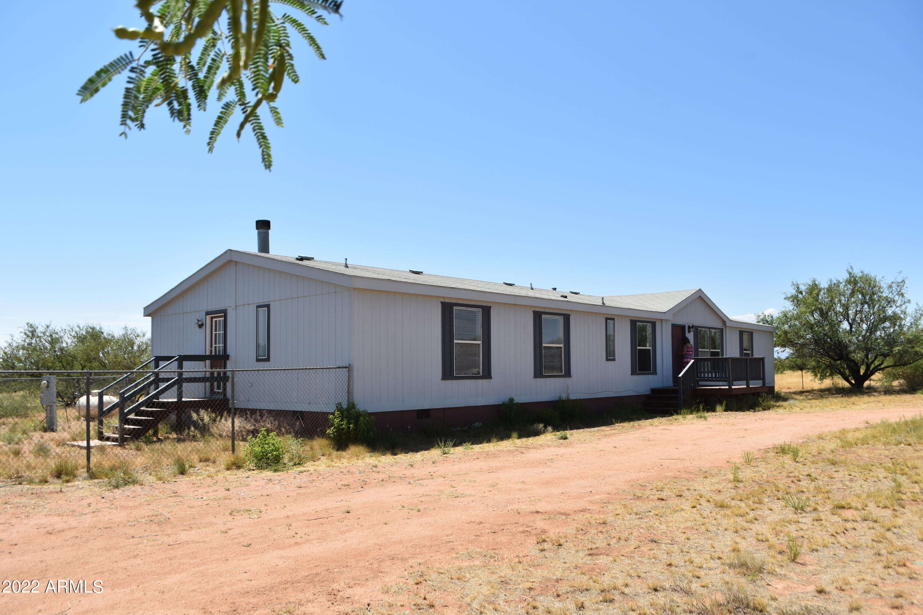 Fabulous views from this home on  a little more than four acres.  Four bedrooms three full bathrooms,  office room  off of main bedroom,  fireplace in family room, uncovered patio area with views, fenced in yard. Large storage area.
Motivated Seller.