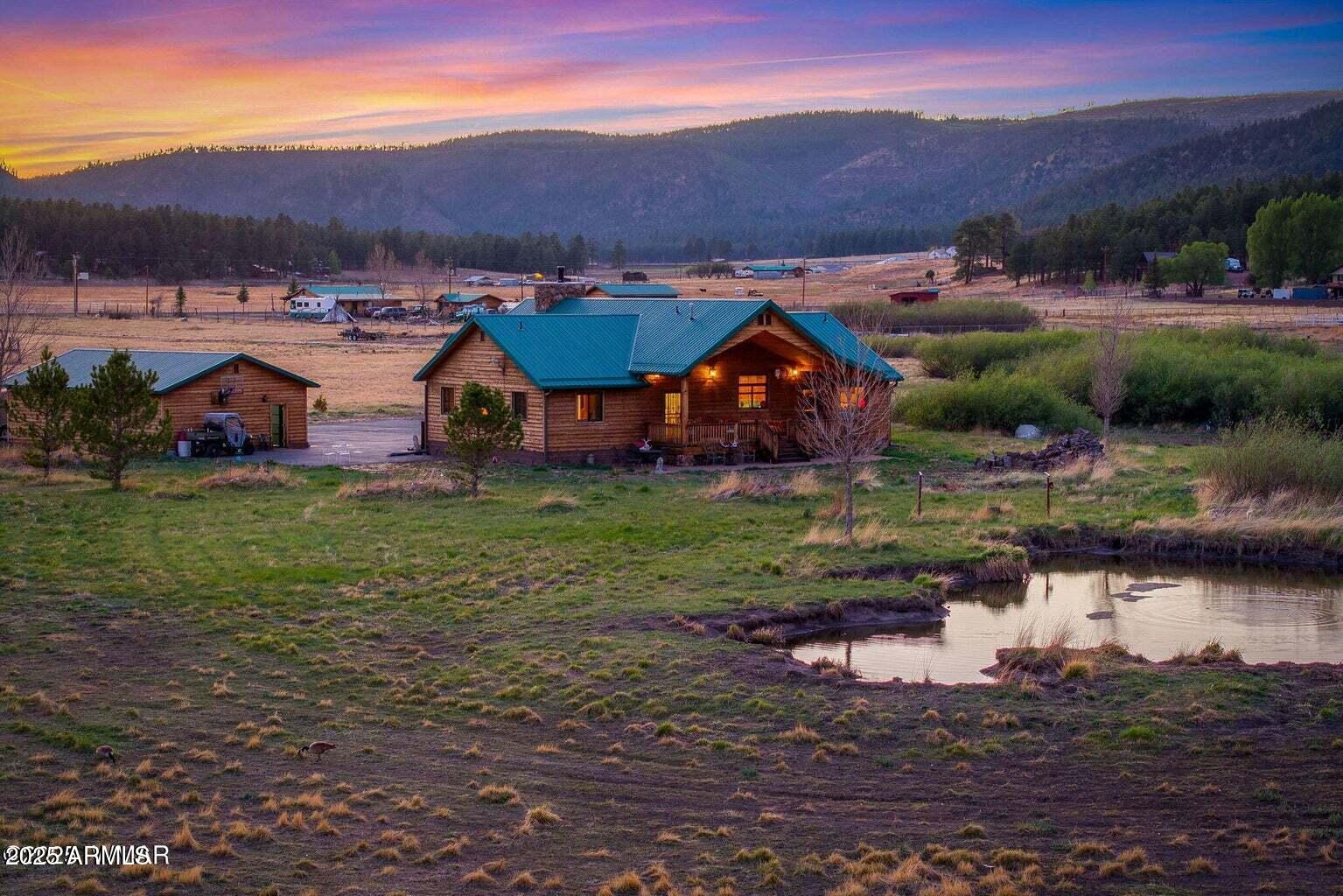 Situated in the heart of Alpine, Arizona, in the beautiful White Mountains, this exceptional 29Â± acre horse property offers the ultimate
in privacy, space, and all-season mountain living. A private gated entrance welcomes you to a custom-built, cedar-sided 3-bedroom, 2-bath home
designed for comfort and durability, featuring 10-foot walls, vaulted ceilings, a striking floor-to-ceiling John Wayne-style faux rock fireplace, maple
hardwood floors, slate in bathrooms and laundry, Berber carpet in bedrooms, and covered redwood decks perfect for taking in the views.