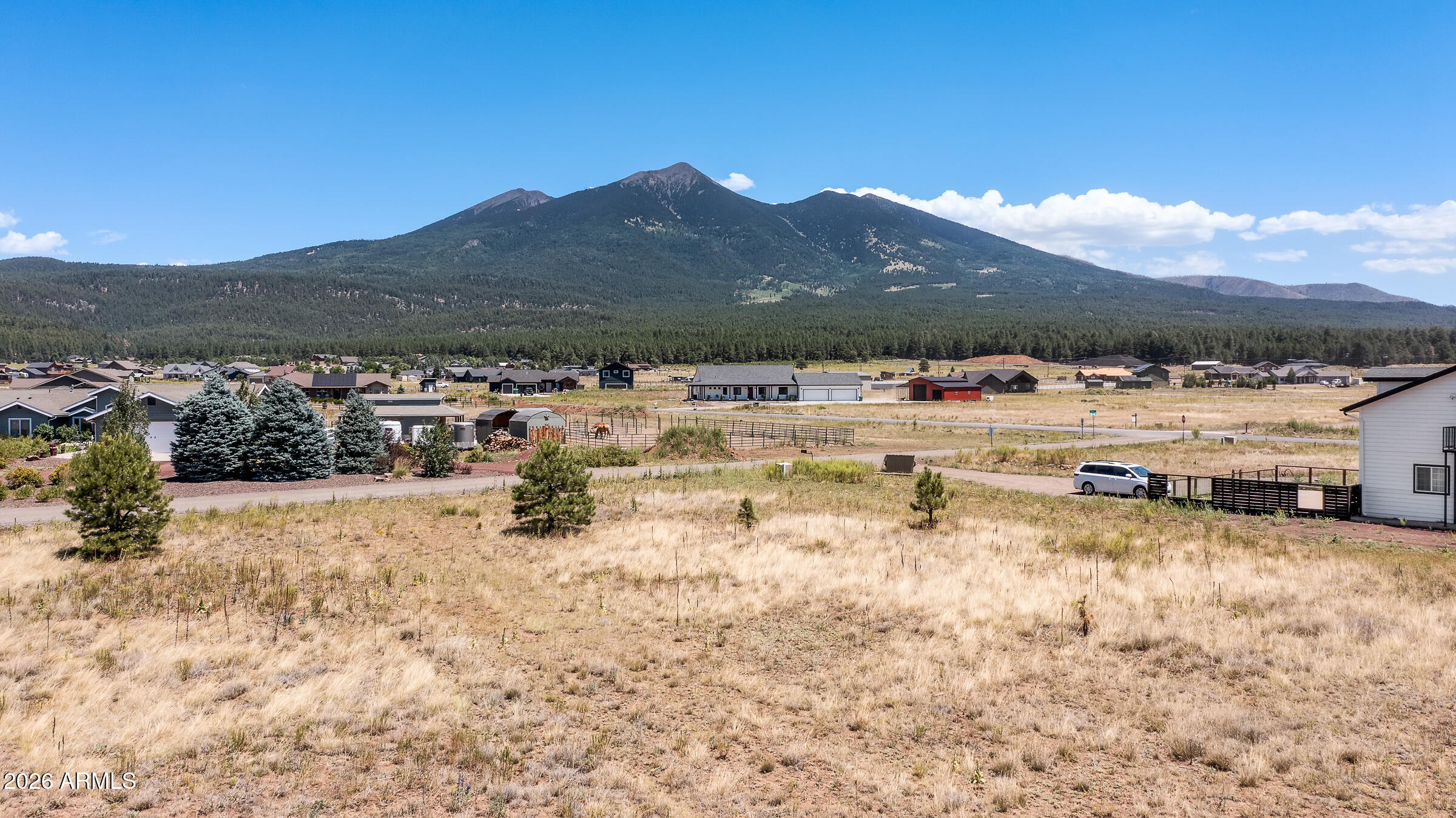 VIEWS, VIEWS and MORE VIEWS!! Build your dream mountain retreat on this rare, level 2-acre lot in the desirable Fort Valley/Baderville area of Flagstaff. This build-ready parcel offers unobstructed, panoramic views of the San Francisco Peaks--truly some of the best views in the region. Whether you're planning a custom home or a spec build, this property provides the perfect canvas. Located just 8 miles from downtown Flagstaff and minutes from the Arizona Snowbowl, you'll enjoy convenient access to year-round recreation, including skiing, hiking, biking, and forest exploration. Despite its close proximity to town, the setting offers a peaceful, rural feel with incredible privacy and natural beauty. The lot features flat terrain and existing underground utilities, including electricity and natural gas (to the lot line) making construction straightforward. Nearby properties are already developed, giving you confidence in the area's long-term value and appeal.

Enjoy stunning sunsets, crisp mountain air, and dark star-filled nights from this premium homesite. With limited inventory in this sought-after neighborhood, opportunities like this are few and far between. Don't miss your chance to own one of Flagstaff's most scenic and buildable parcels.