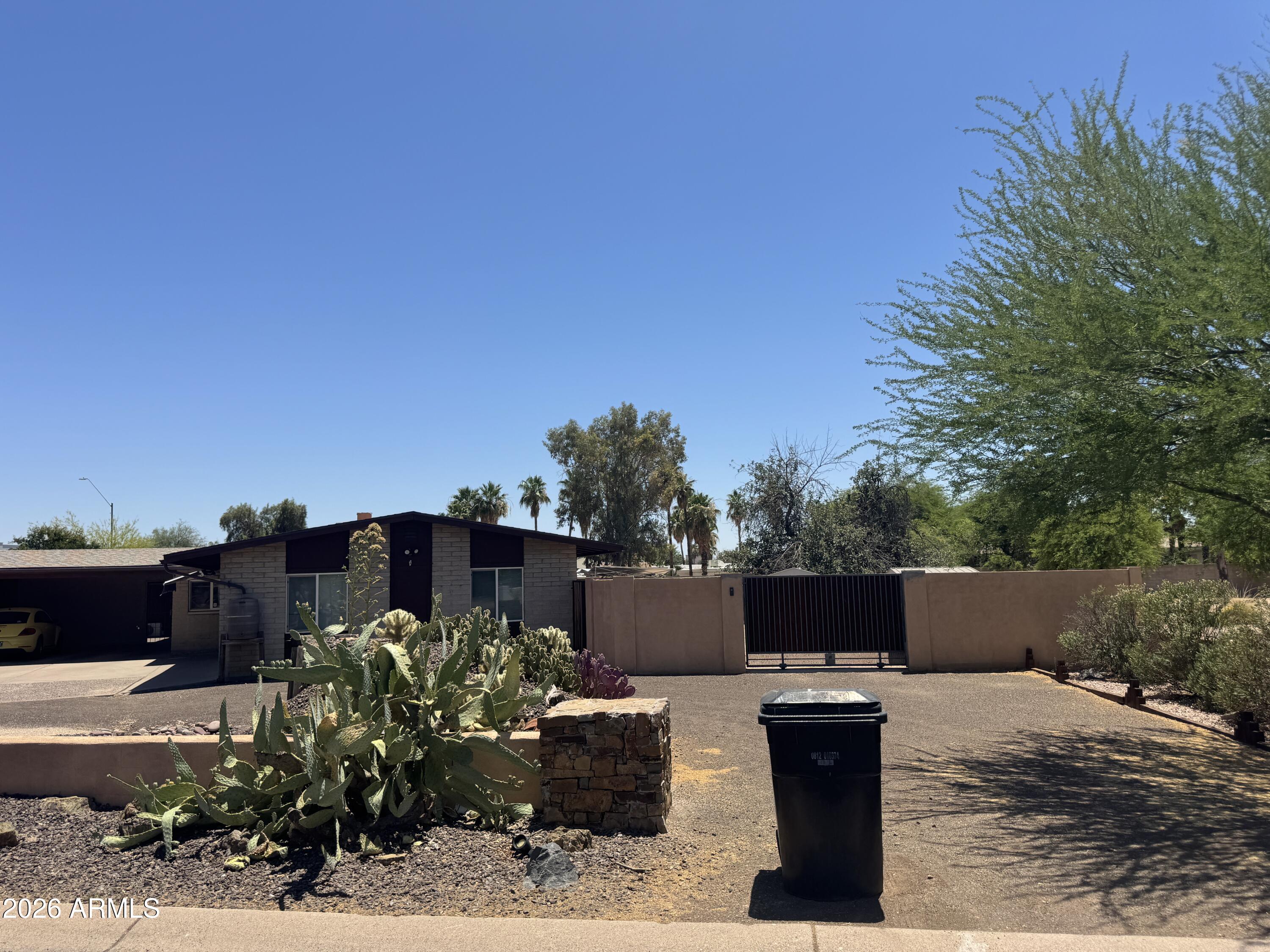 Rare opportunity to own one of the few remaining large corner parcels in the highly desirable 85254 zip code. Situated on nearly an acre, approximately 36,000 square feet, at the prominent intersection of Scottsdale Road and Cholla Street, this 5-bedroom, 2.5-bath home offers exceptional visibility, access, and long-term potential.

The property presents a wide range of possibilities, whether as a luxury residential rebuild, investment property, or potential commercial/mixed-use redevelopment. Buyers should verify all zoning, use, and redevelopment options directly with the City of Scottsdale.

With no HOA restrictions, the property offers added flexibility for builders, developers, investors, or end users looking to create a custom private estate or pursue a high-exposure redevelopmen