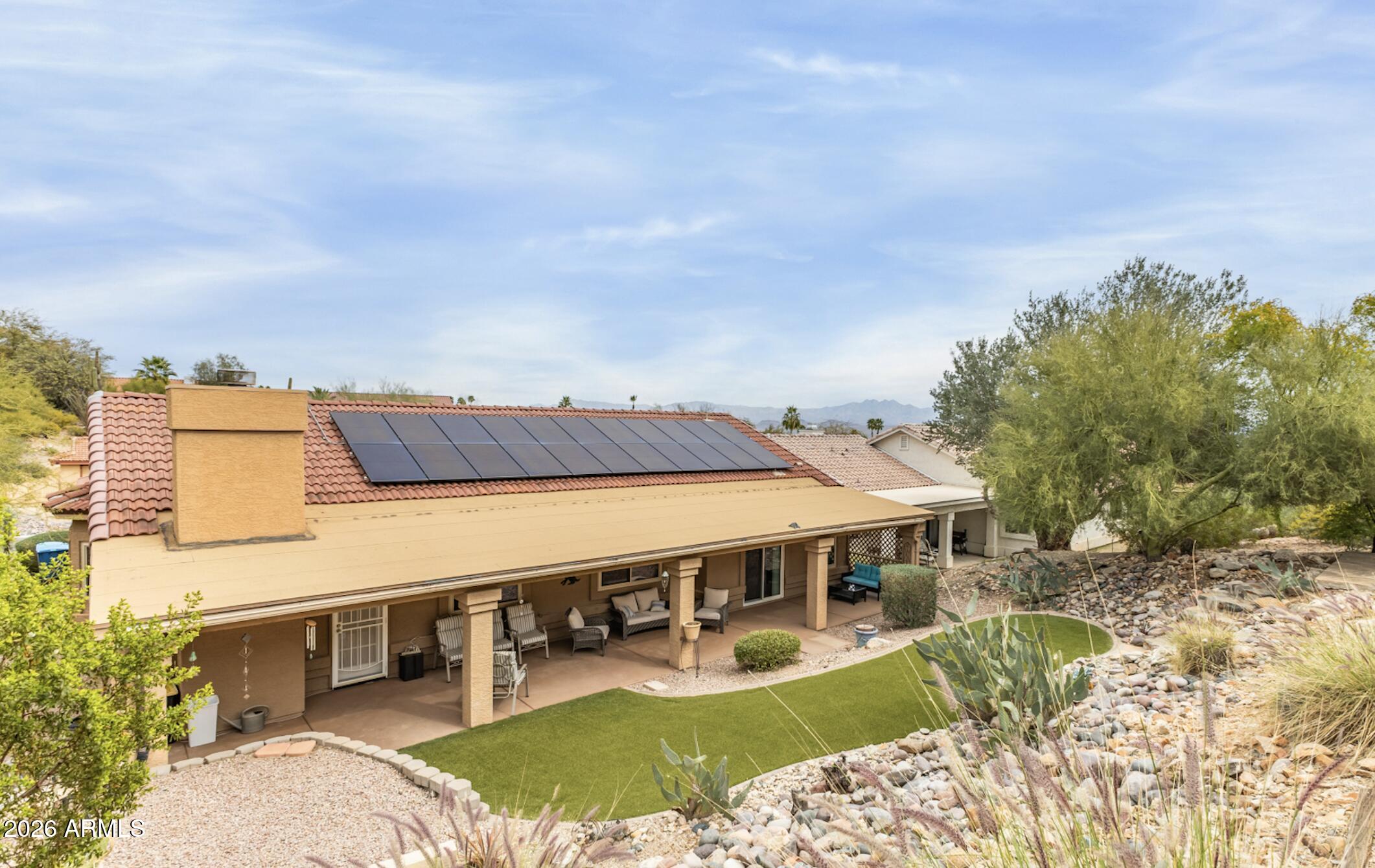 NEW PRICE! Take a look at this beautiful energy efficient affordable home at an amazing price in Fountain Hills!  NEW WINDOWS and OWNED SOLAR panels provide energy efficiency throughout the house. Spacious kitchen with lots of storage and is open to living area, perfect for entertaining.   Have morning coffee on the front patio, then relax in the evening on the back covered patio overlooking a lovely private backyard. The main bedroom is spacious, and has a patio door leading to a backyard patio. No HOA. Welcome home!