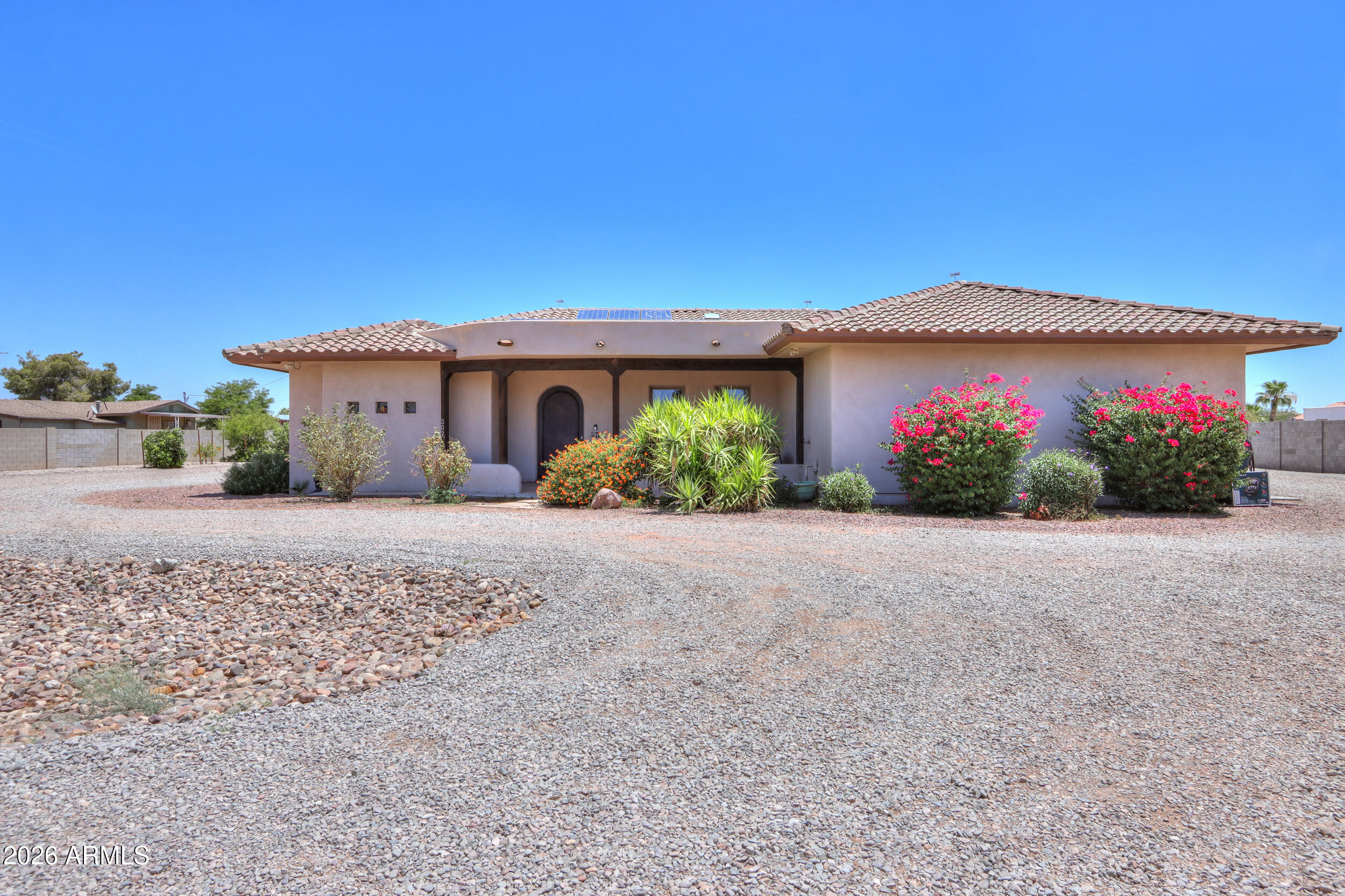 Luxury country living meets the perfect private retreat in the heart of town on 1.21 acres with NO HOA! This stunning hidden gem offers endless space for toys, animals, hobbies, and entertaining. Featuring 2,957 sq ft, 4 bedrooms, 2.5 baths, den, sparkling pool, shop, horse corral, chicken coop, and beautifully updated landscaping with mature trees throughout. Gourmet kitchen boasts Sub-Zero side-by-side fridge/freezer, Bosch stove, custom hood with warming shelf/heat lamps, granite countertops, RO system, and breakfast bar. Spacious primary suite offers private patio access, walk-in rock tile shower, walk-in closet, and vanity. Backyard oasis features an extended covered patio, grassy play area, refreshing pool with new cool decking, plus convenient guest bath access from the backyard. Extended garage with abundant cabinetry and storage. Home does have owned solar and so much more. You won't believe it, until you see it. Don't wait, or it may be too late.