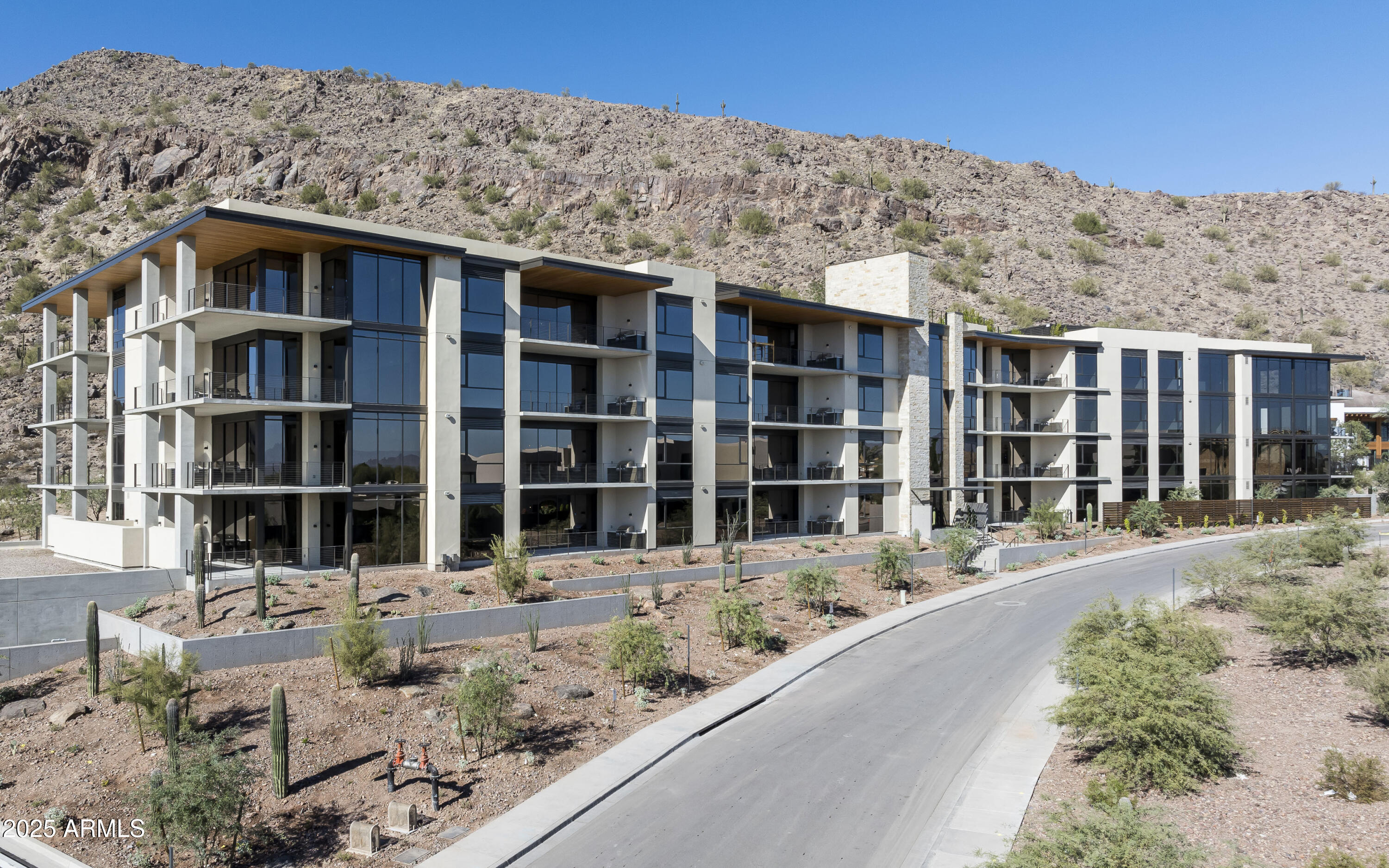 Tucked at the base of revered Camelback Mountain, this new private residential enclave is adjacent to The Phoenician Resort - one of Arizona's premier luxury resort destination. This community incorporates the Sonoran Desert landscape directly into its design, at the most enviable location in Scottsdale. Ascent offer views overlooking the Valley & Camelback Mountain. Home designs feature contemporary architecture integrating warm, natural materials, expansive windows, and large outdoor patios. Thoughtfully designed by Nelsen Architects and Vallone Interior Design. Luxury finishes include exquisite Bulthaup Kitchens, Provenza wood floors, Sub Zero Wolf appliances & 10' ceilings.