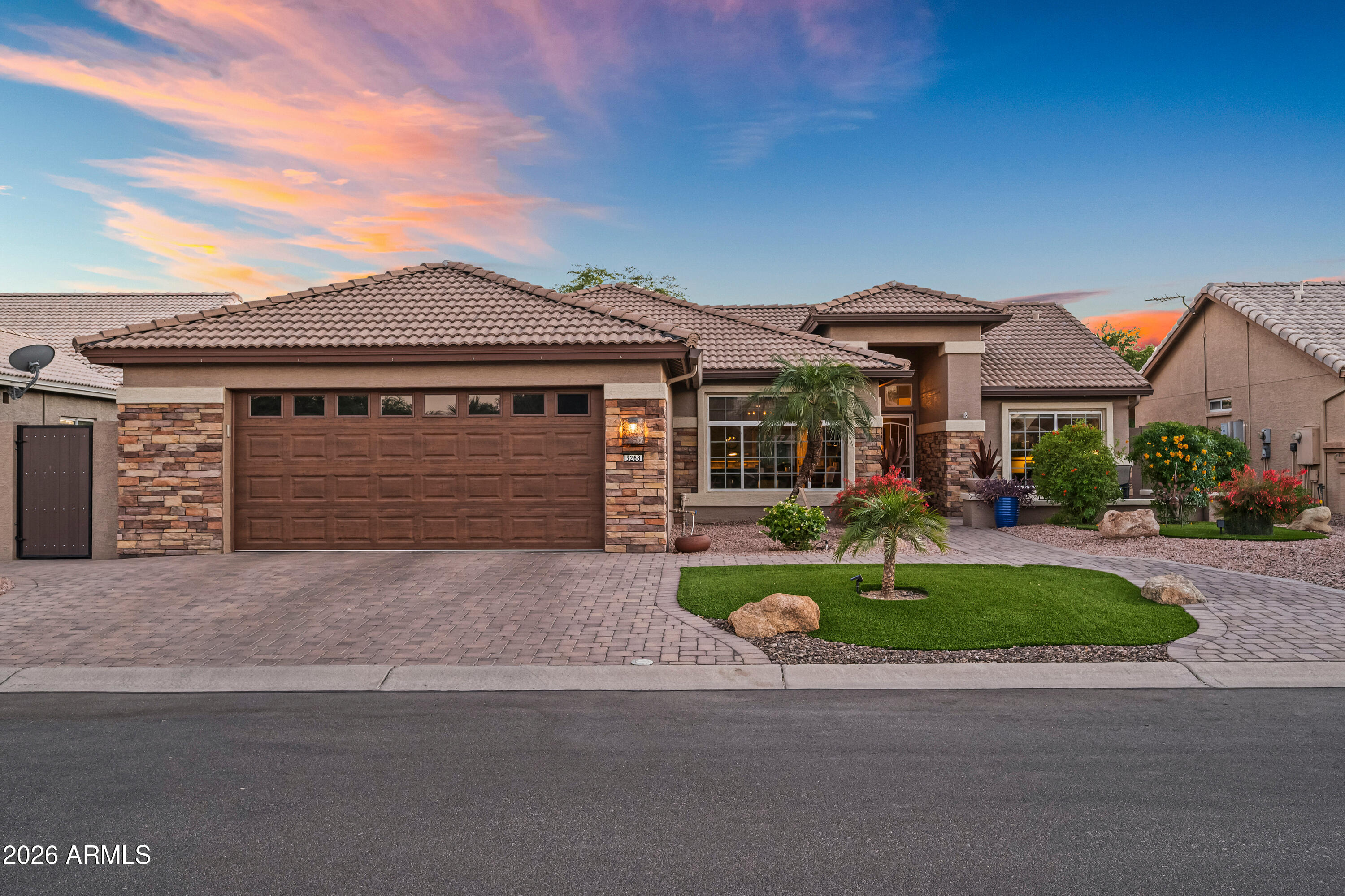 Amazing Home With Upgrades Galore & Truly an Oasis Backyard with a Brand New Pool with Added Water Features (2023), Large Extended Pergola (2023), Raised Flower Beds, & Built-In Barbecue! The Curb Appeal from the Front & Backyard is Excellent with Paver Bricks covering the Driveway, Sidewalk, & Courtyard, Professional Landscaping, Stone Facade to Enhance the Beauty & Esthetic of the Home, & Artificial Turf in just the Right Places... Kitchen Updated in 2021 with Stainless Appliances, Beautifully Selected Light Tone Quartz Countertops, Neutral Tone Backsplash, & Professionally Painted Dark Tone Cabinetry... Neutral Tone Vinyl Plank Flooring (2021), New Baseboards, & Painted Accent Walls... The Warmth in the Living Room starts with the Built-In Fireplace, Color Tones, & Custom Window Coverings throughout the Home... Huge Primary Suite Closet, Two Baths Remodeled with New Quartz Countertops, Newly Tiled Showers, & Professionally Painted Cabinetry... The Garage is Oversized in Length Able to Easily Fit your Truck, Car, Added Space for a Golf Cart, & Still has Room for a Work Area... The Epoxy Floors in the Garage Adds Just the Right Clean Look....THIS HOUSE IS TRULY A BEAUTY SO DO NOT MISS IT.... All Located in the Scottsdale of the West....PebbleCreek Golf/Pickleball Community offering 3-18 Hole Golf Courses, 40+ Pickleball Courts, 3 Outdoor Pools, 1 Indoor Pool, Theatre, Art Center, Over 100 Clubs and So Much More!