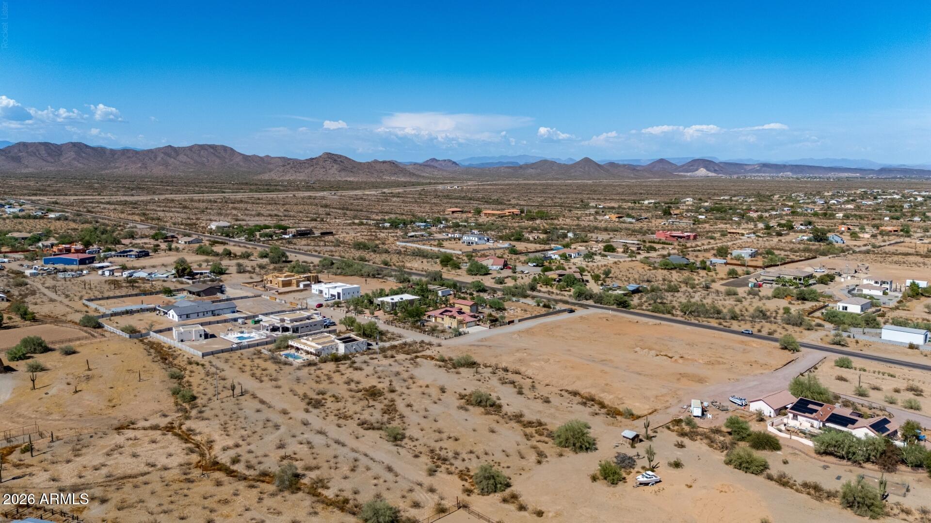 Rare opportunity to own a 2+ acre custom home lot in Surprise, AZ with no HOA, breathtaking mountain views, and utilities at the lot line. Build your dream home on this premium Arizona homesite with water and electric available, marked property corners, and easy access to 163rd Ave. Seller has completed valuable pre-construction work, including a survey map, custom home blueprints, and preliminary percolation testing with paid invoice. Plenty of space for a custom home, RV garage, workshop, horses, and all your toys. Enjoy peaceful desert living while remaining close to shopping, dining, and the continued growth of Surprise. An exceptional Arizona land investment with endless possibilities.