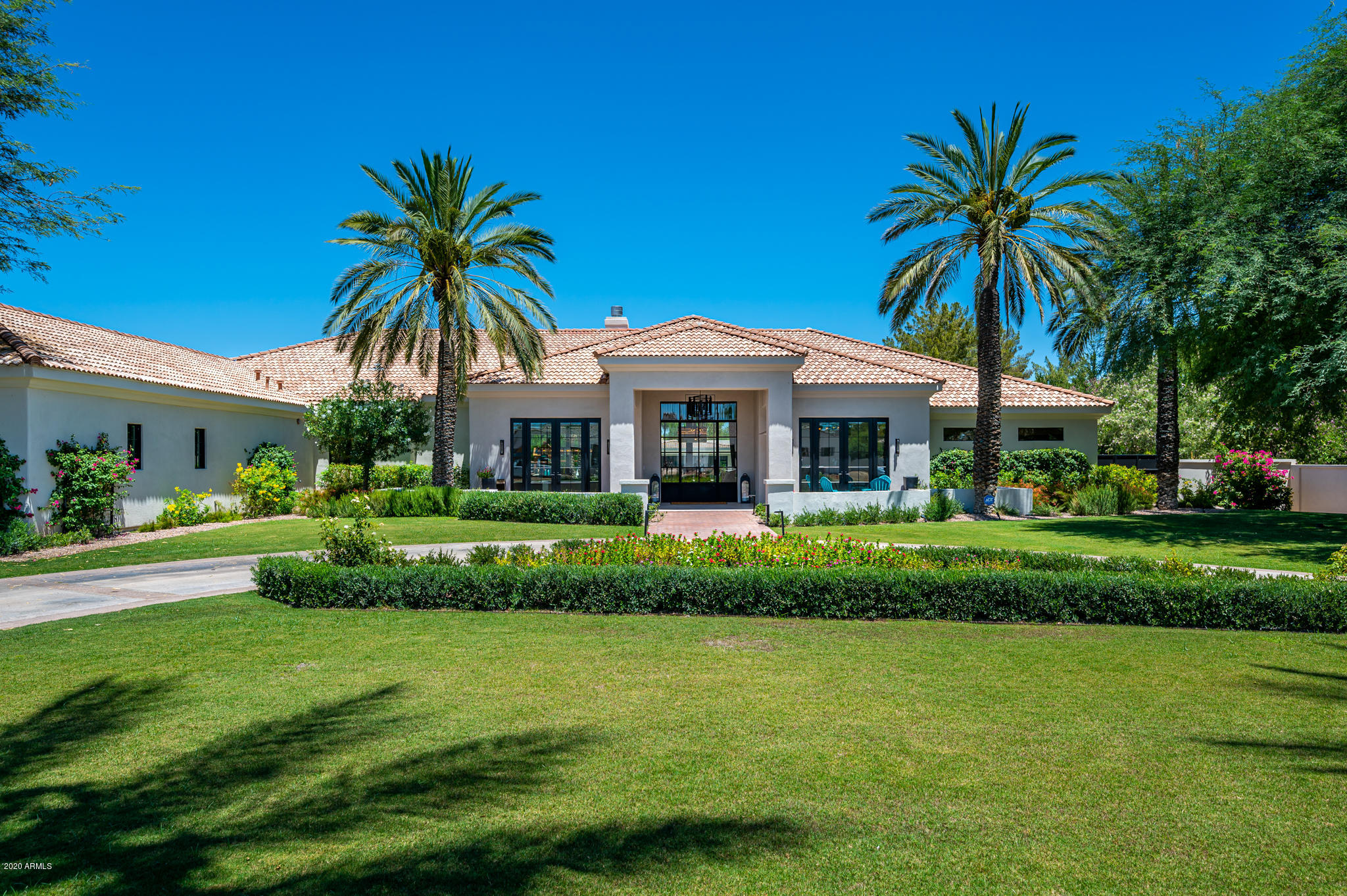 Quite possibly the best entertainer's backyard on the market at any price!  Gorgeous estate on almost 1.2 acres in the heart of PV. Imported Italian tile and European white oak hardwood flooring throughout. Incredible kitchen with custom inset cabinetry, marble & granite countertops and Sub-Zero/Wolf appliances. Fleetwood doors throughout perfect for indoor/outdoor living! Ideal split floor plan, all en-suite bedrooms, huge bonus room with kitchenette and separate entrance/driveway (could be attached guest Casita, theater, gym, second office or playroom for kids.) Single level, N/S exposure, laundry in the master closet, extensive A/V throughout the home and backyard. 1344sf pool house with full kitchen, full bathroom, bar, theater room and game room with automated Fleetwood slider.